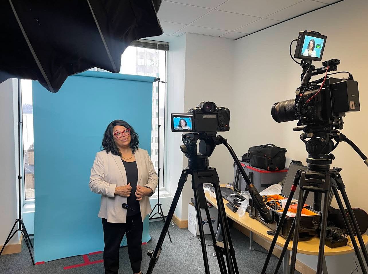 Seattle corporate videographer preparing a client for a professional business interview