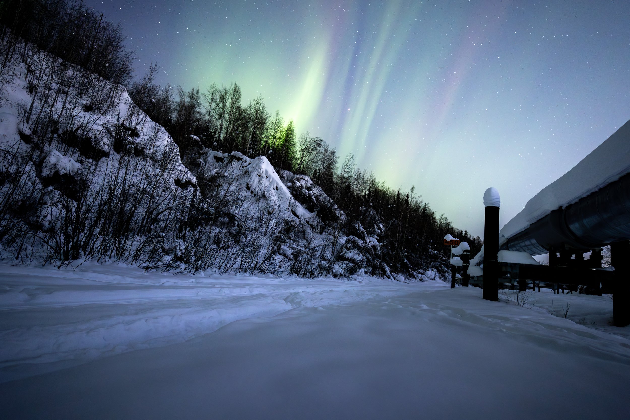 Alaskan Pipeline Under Northern Lights