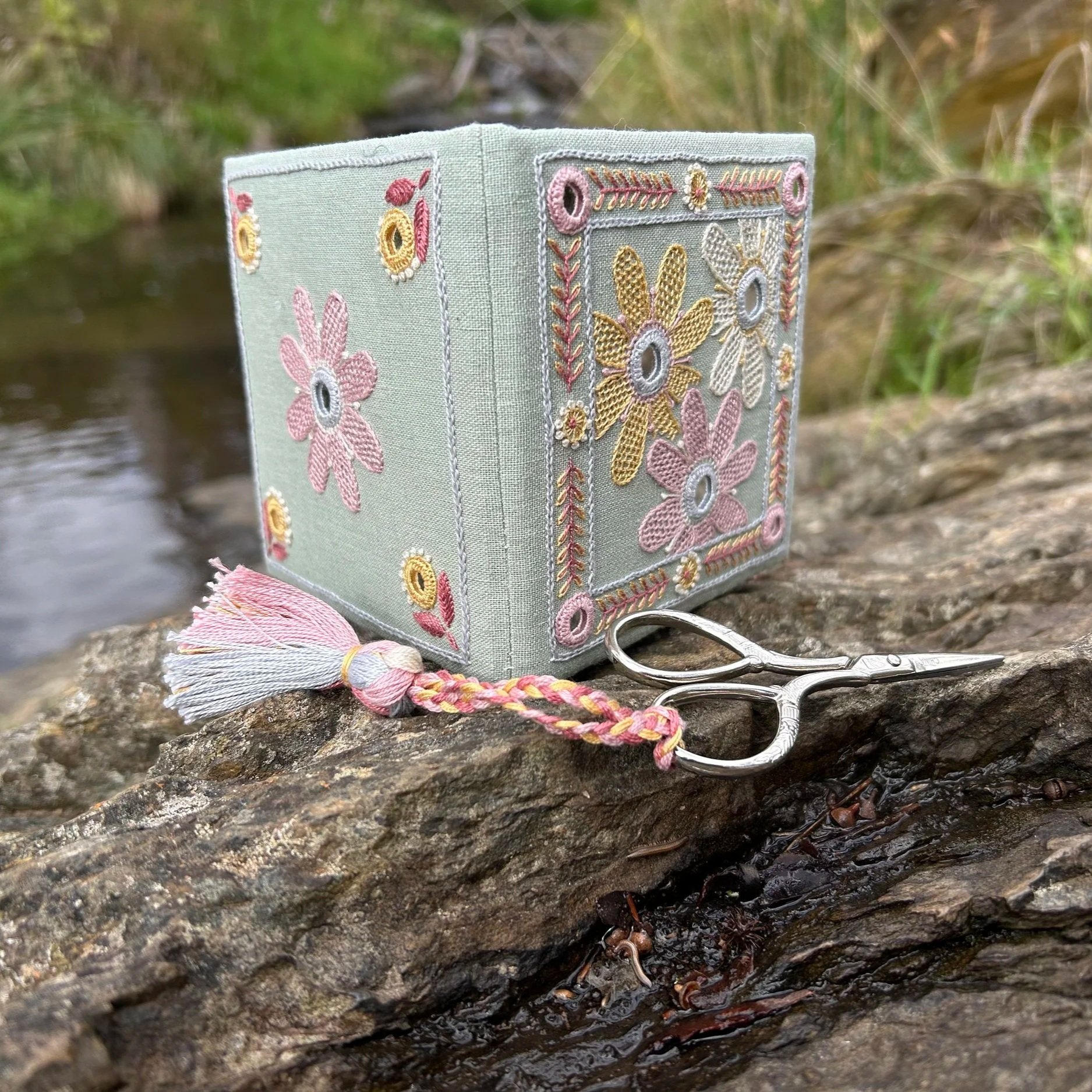 Embroidered needle book with a comtemporary daisy design using shisha mirrors by Anna Scott Embroidery