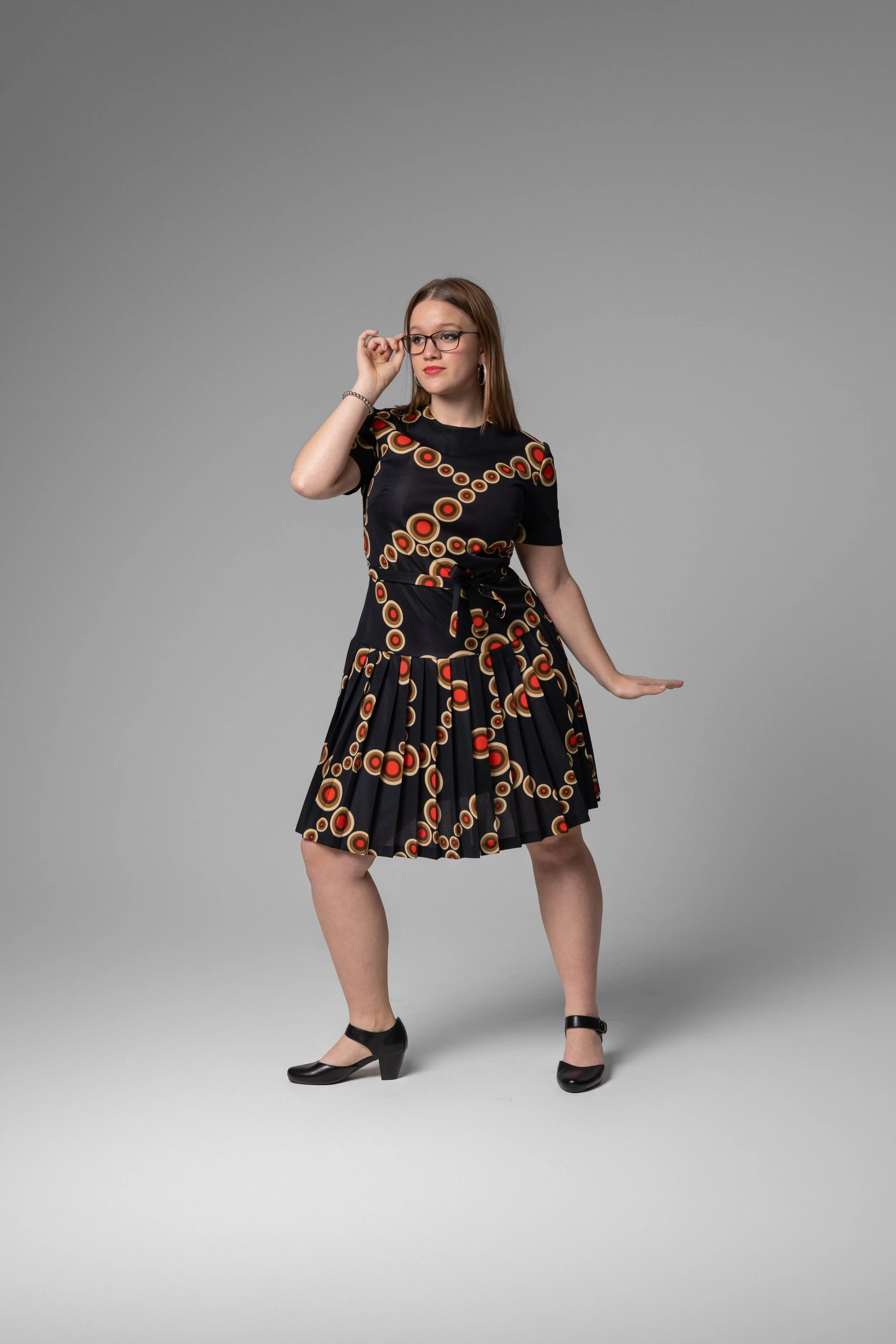 Orange and Black concentric circle drop waist dress
