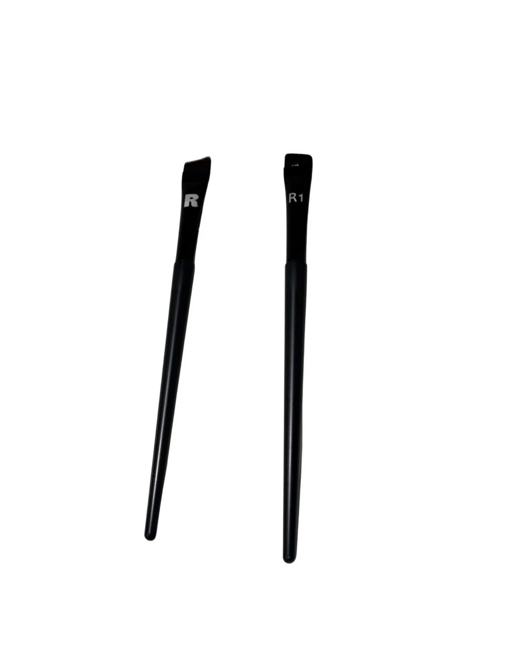 A black-handled Rare Collection Professional Angled Brow Brush featuring a fine, sharply sloped synthetic bristle head designed for precision brow tinting and mapping.