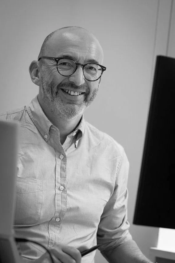 Charles Seifert, Founder at Inside the Box Advisory sitting behind a computer screen