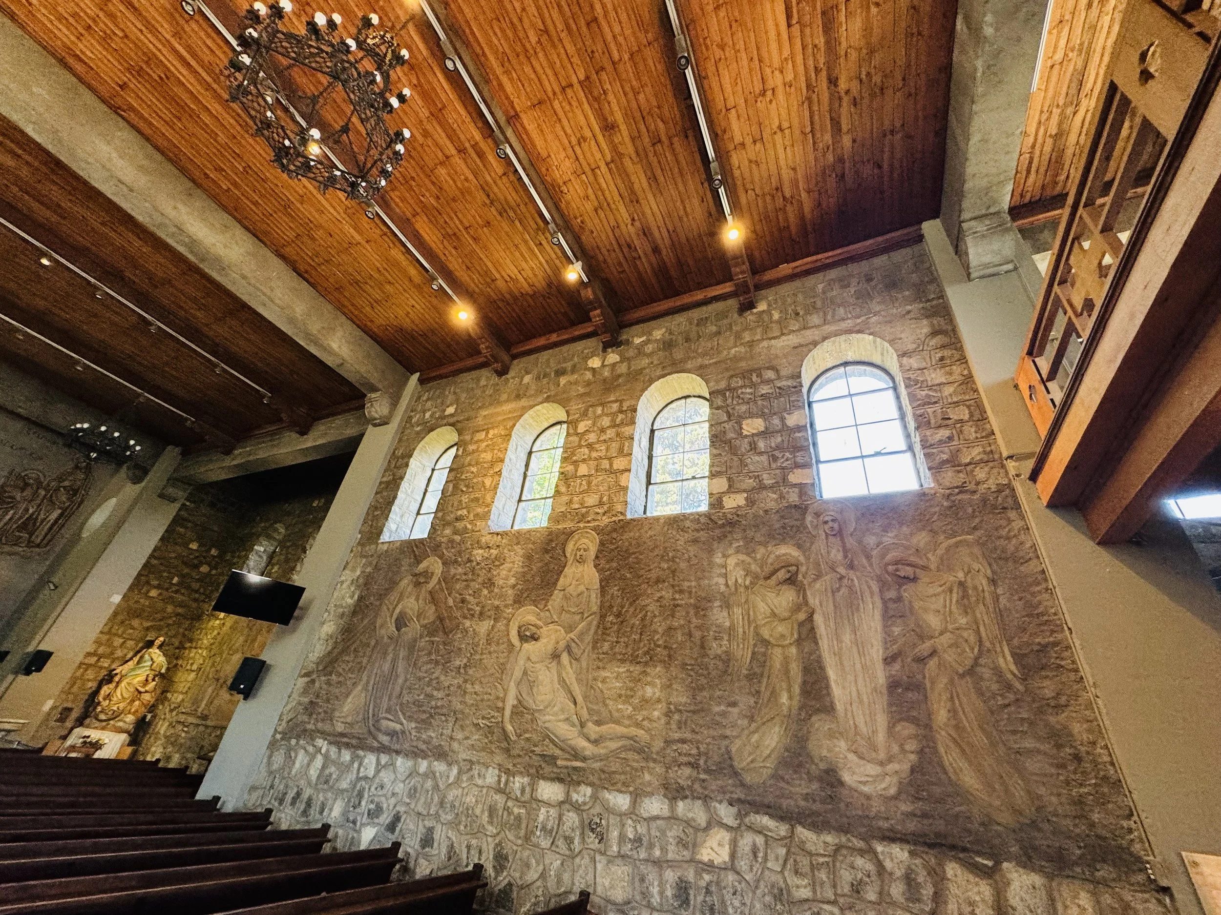 Love the peaceful interior and bas relief carved into the stone wall.