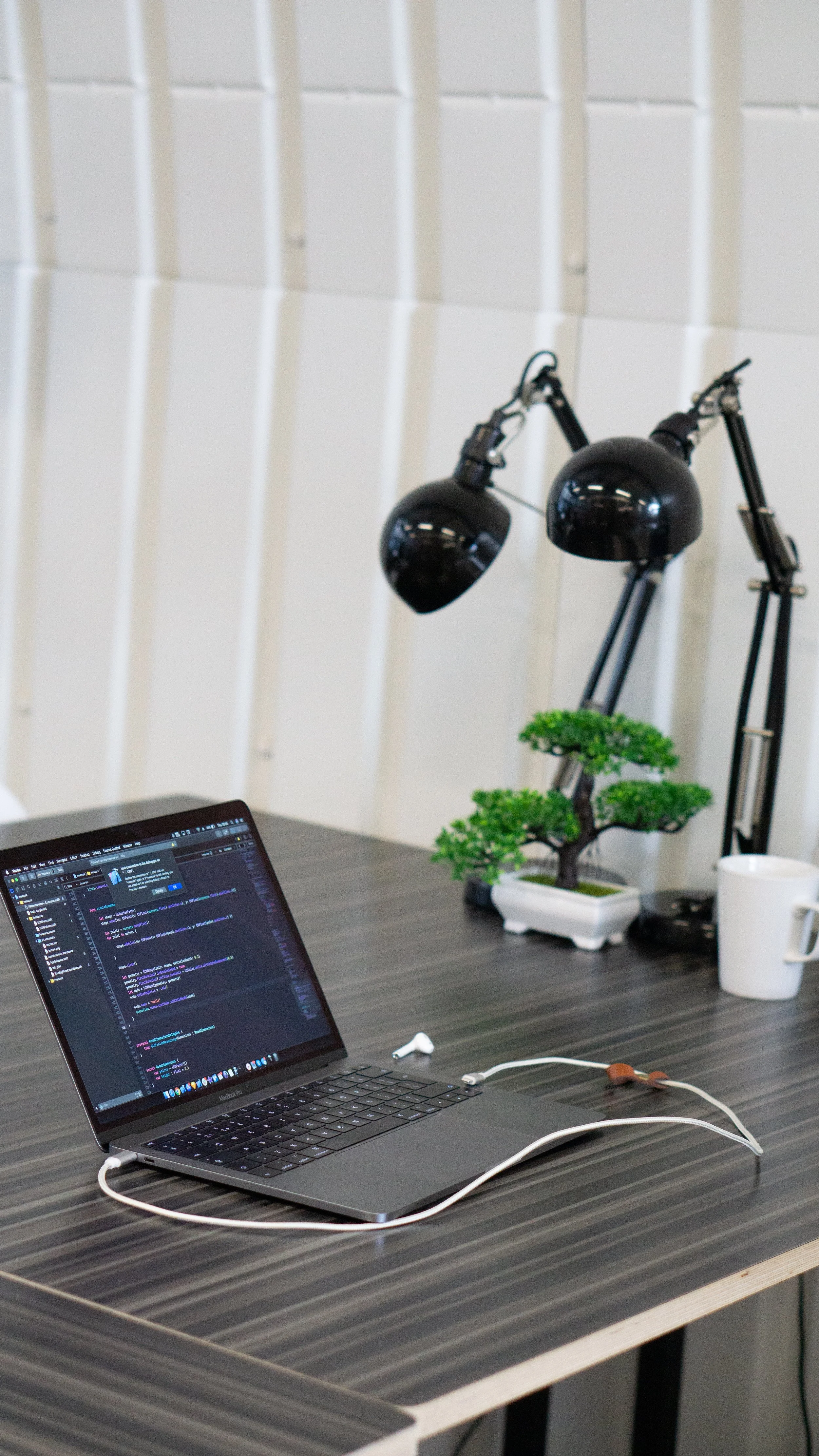 Close of hot desk with laptop at Spare Street Works, London