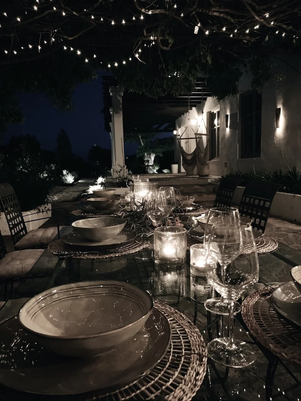 Evening table set with fairy lights at Finca La Marquesa, a peaceful holiday home near Ronda in Andalusia
