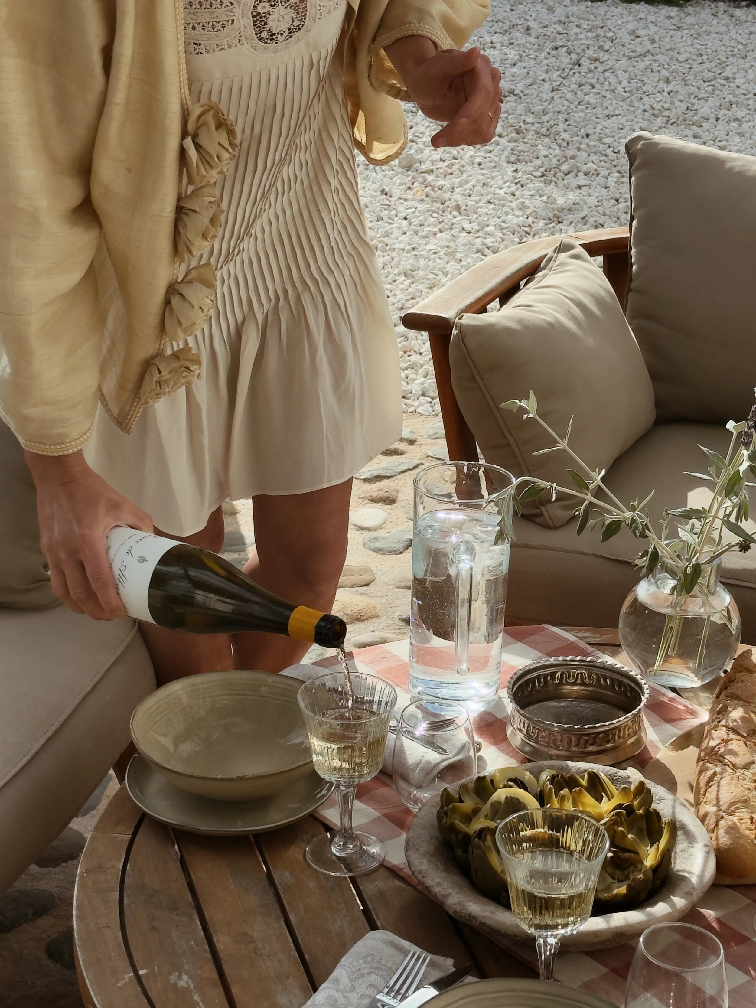 Outdoor dining at Finca La Marquesa, enjoying local wine and Mediterranean cuisine on the terrace near Ronda, Andalusia, Spain.