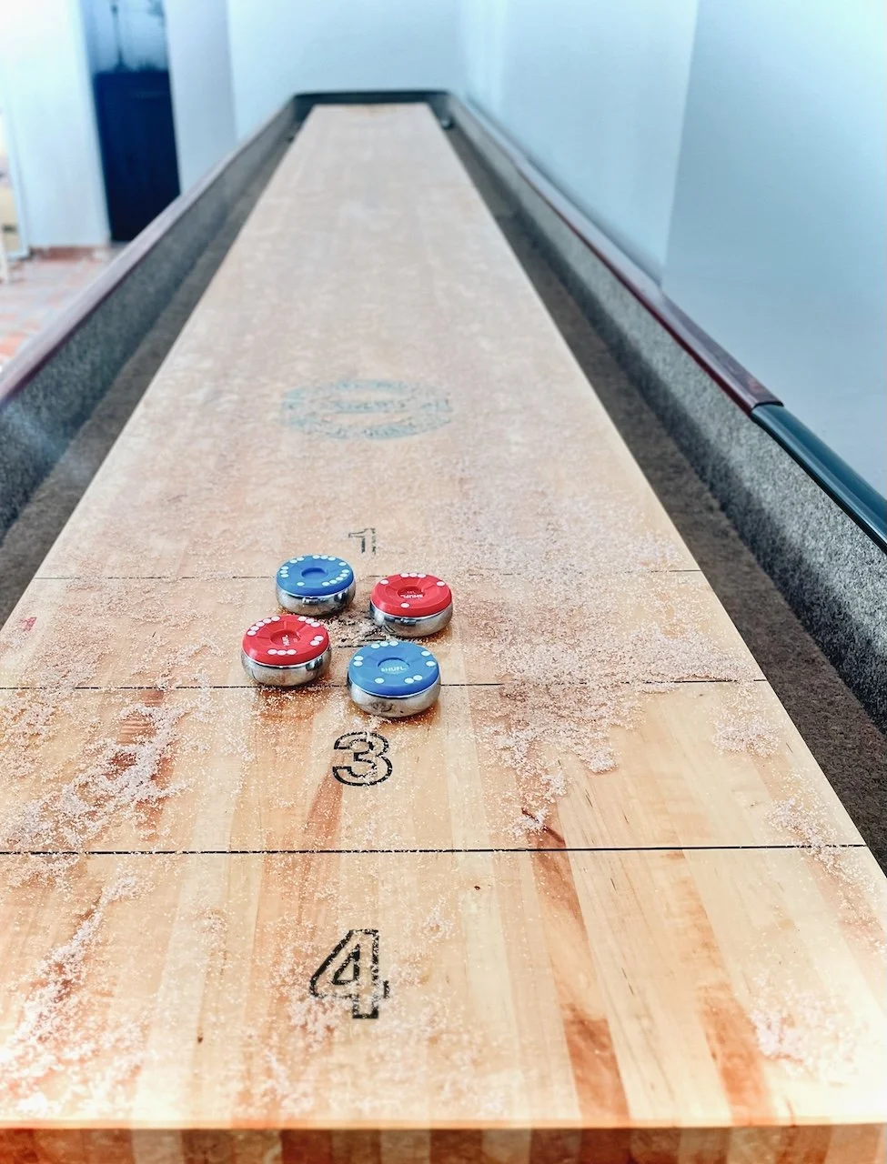 Shuffleboard game at Finca La Marquesa, a family-friendly holiday home near Ronda in Andalusia