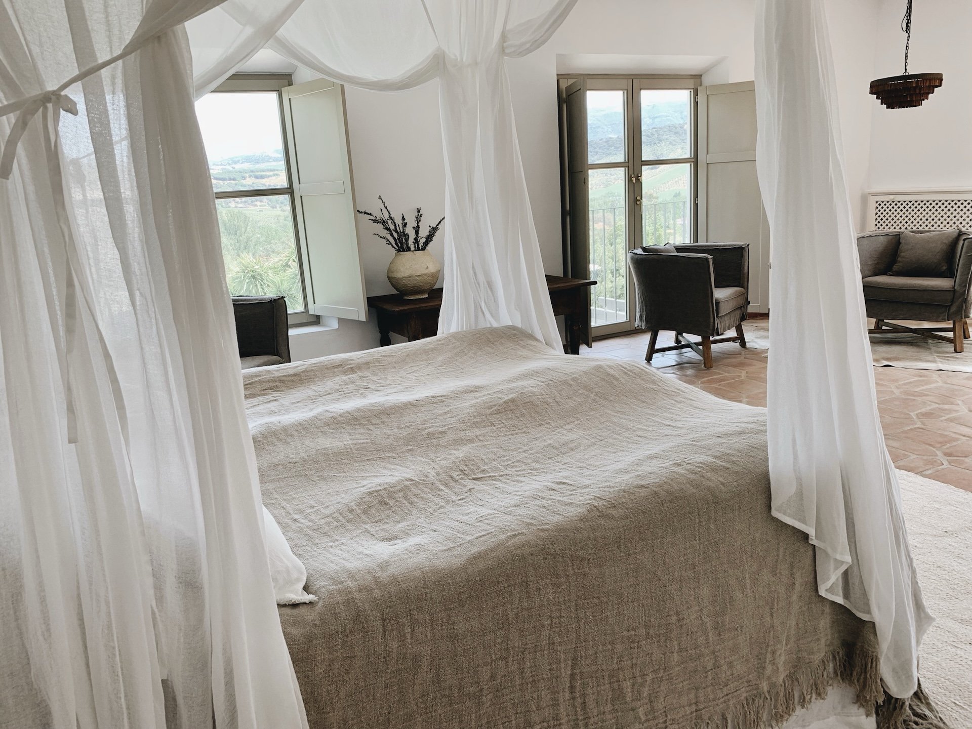 Rustic luxury master bedroom at Finca La Marquesa in the Andalusian countryside