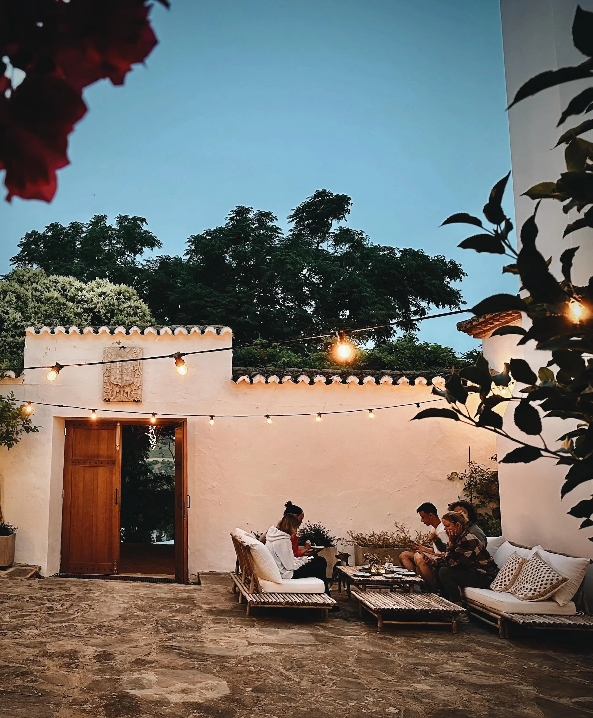 Evening courtyard lounge with fairy lights at Finca La Marquesa, a peaceful holiday home near Ronda in Andalusia