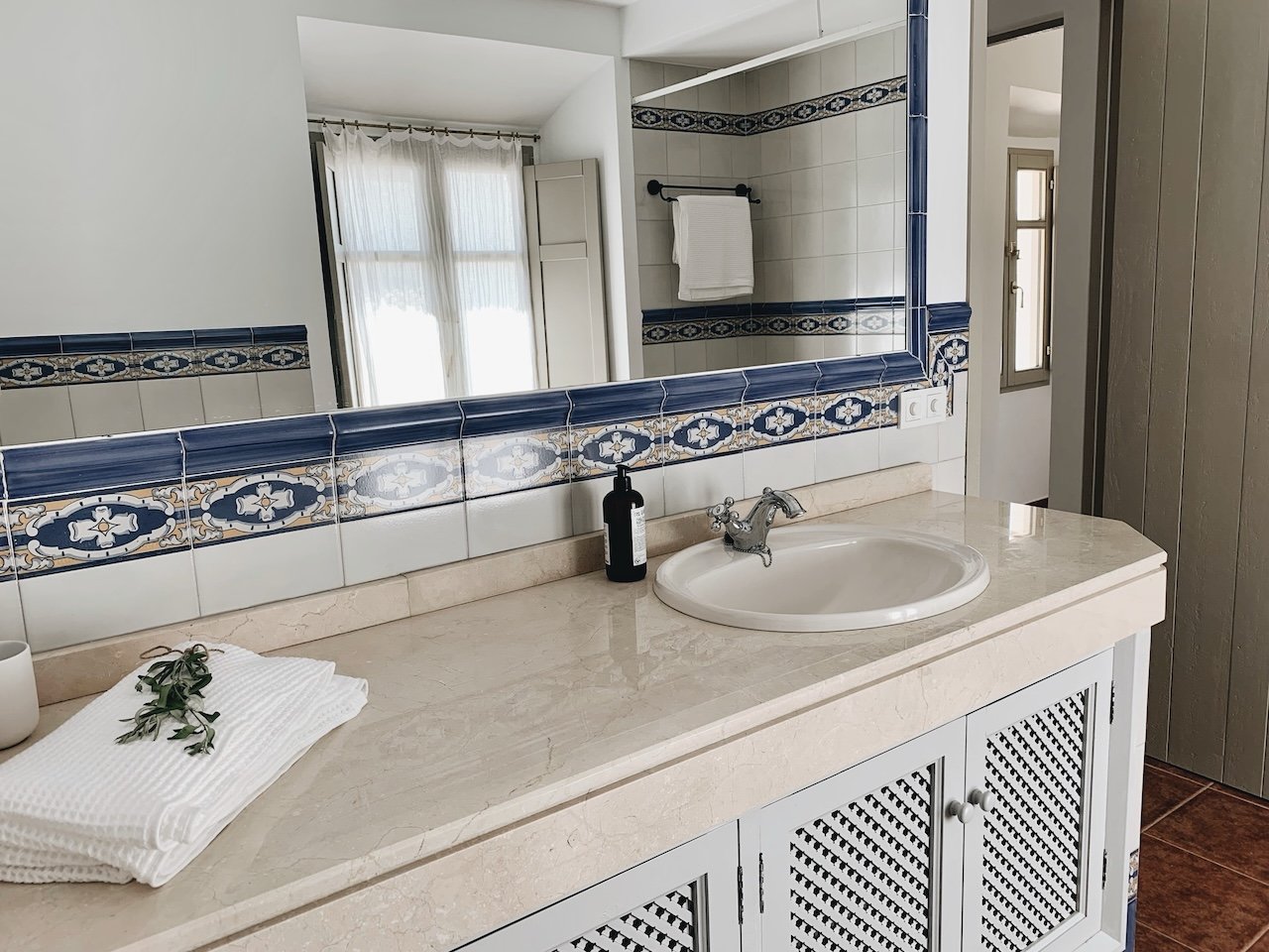 Bright and inviting bathroom in traditional style at Finca La Marquesa in the Andalusian countryside