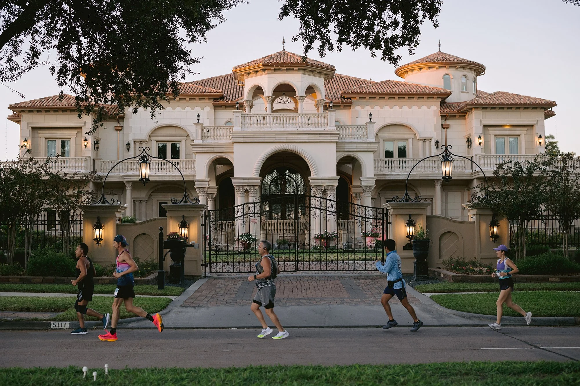 Groups of runners racing through Sugar Land