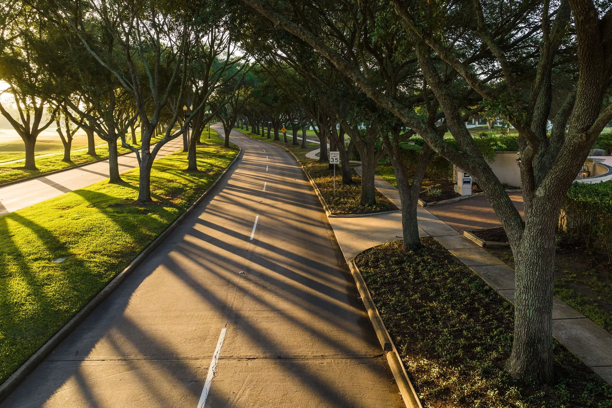 Aerial view of the tree-lined Sugar Land course