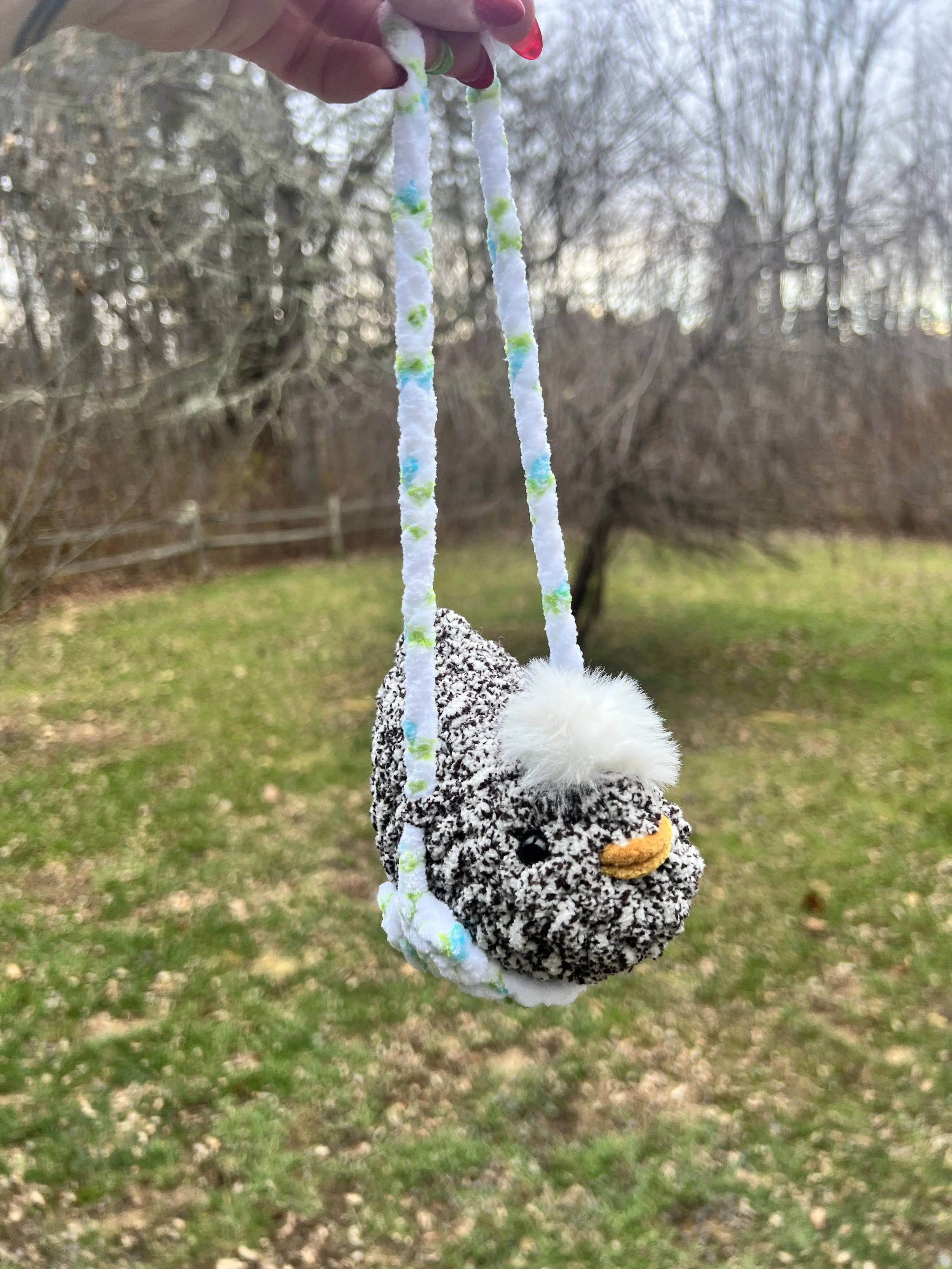 Chicken with White Fluffy Comb on Swing