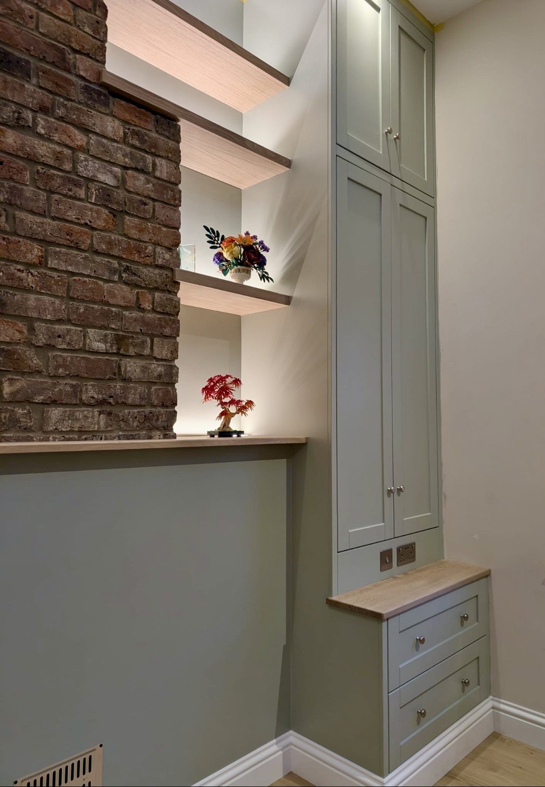 Alcove wardrobe unit with brick feature wall