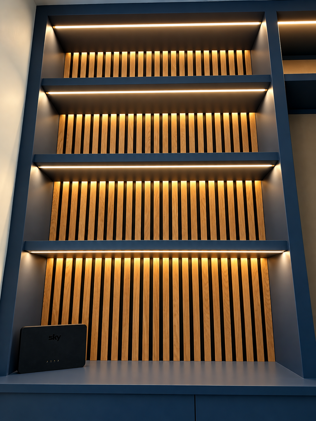 Modern Navy Shelving with Warm Wood Slats.png