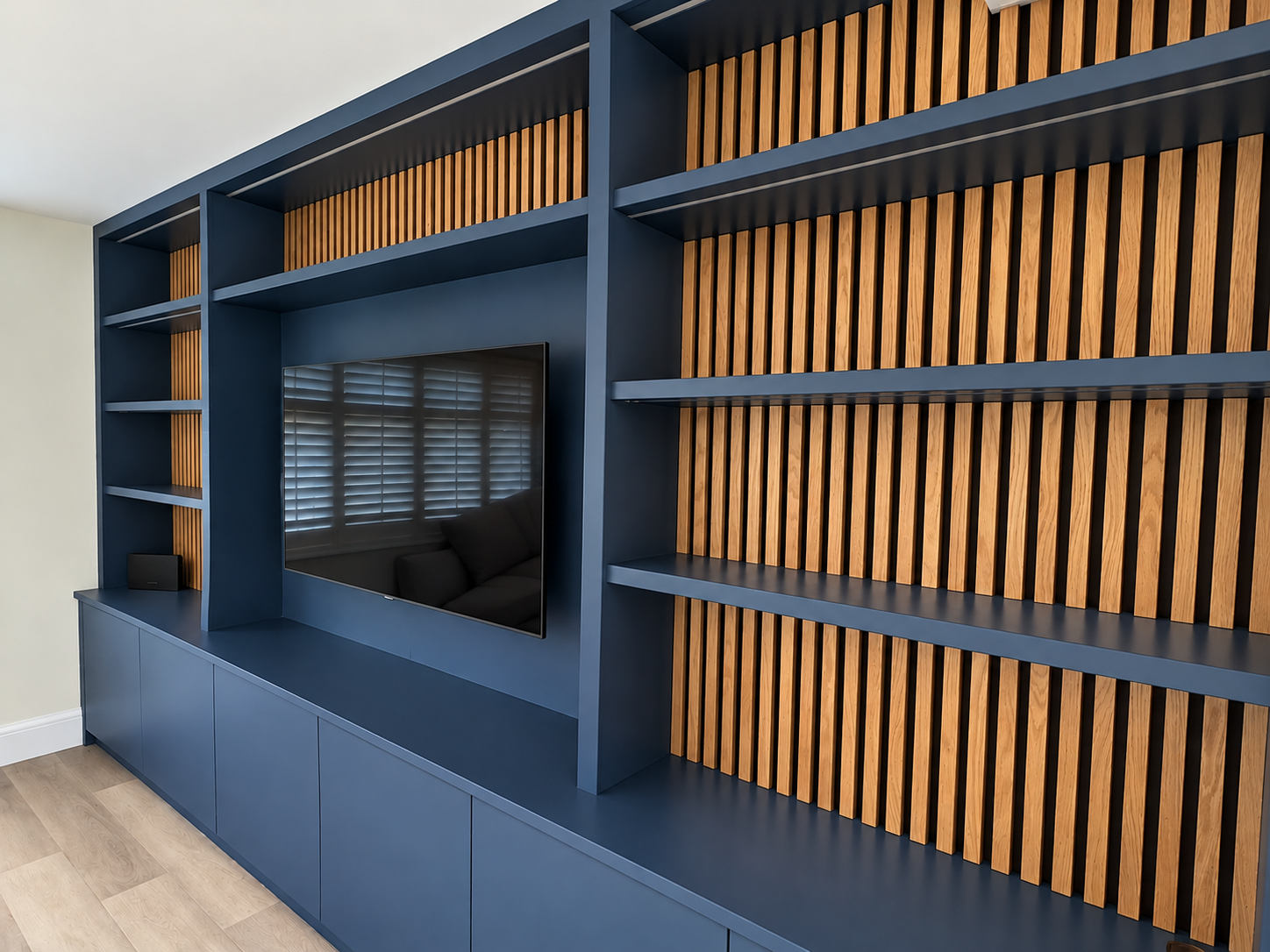 Navy and Oak Media Wall in Daylight.png