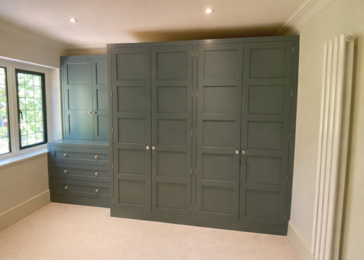 shaker-style solid wood hand painted teal wardrobe and drawers in dressing room