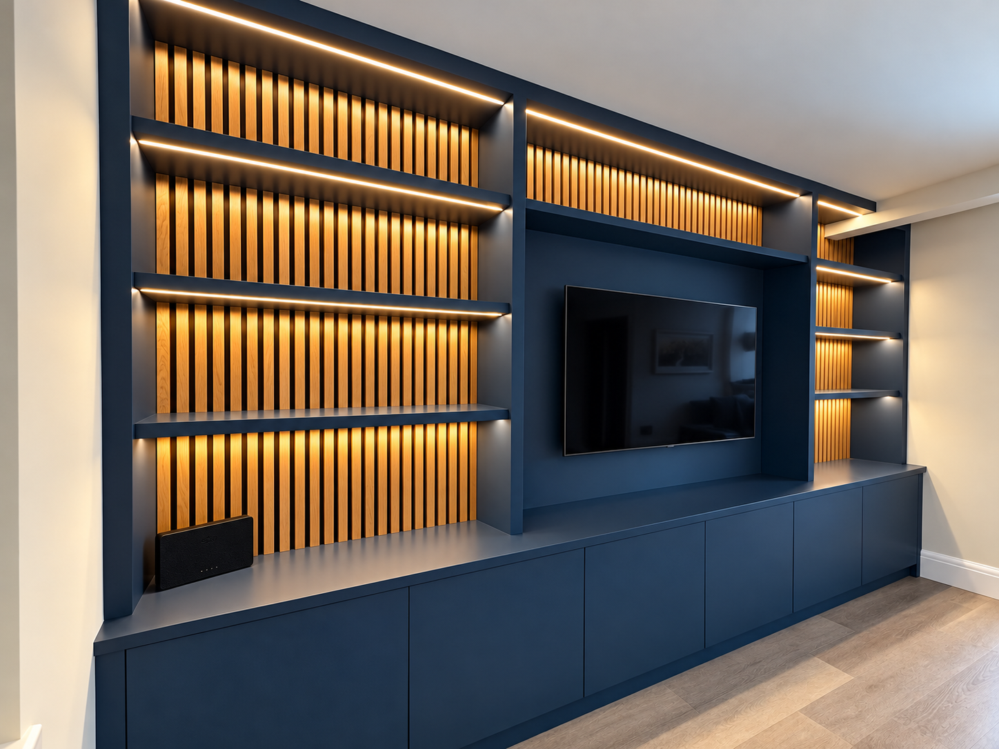 Modern Navy Media Wall with Warm Wood Slats.png
