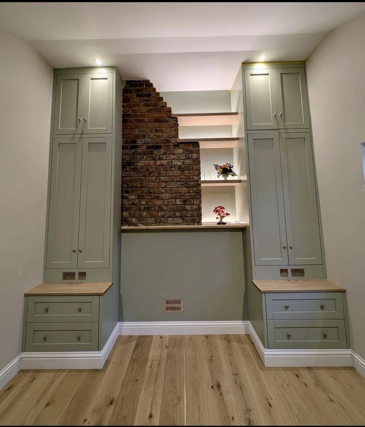 extra tall custom-made wardrobe built around chimney breast
