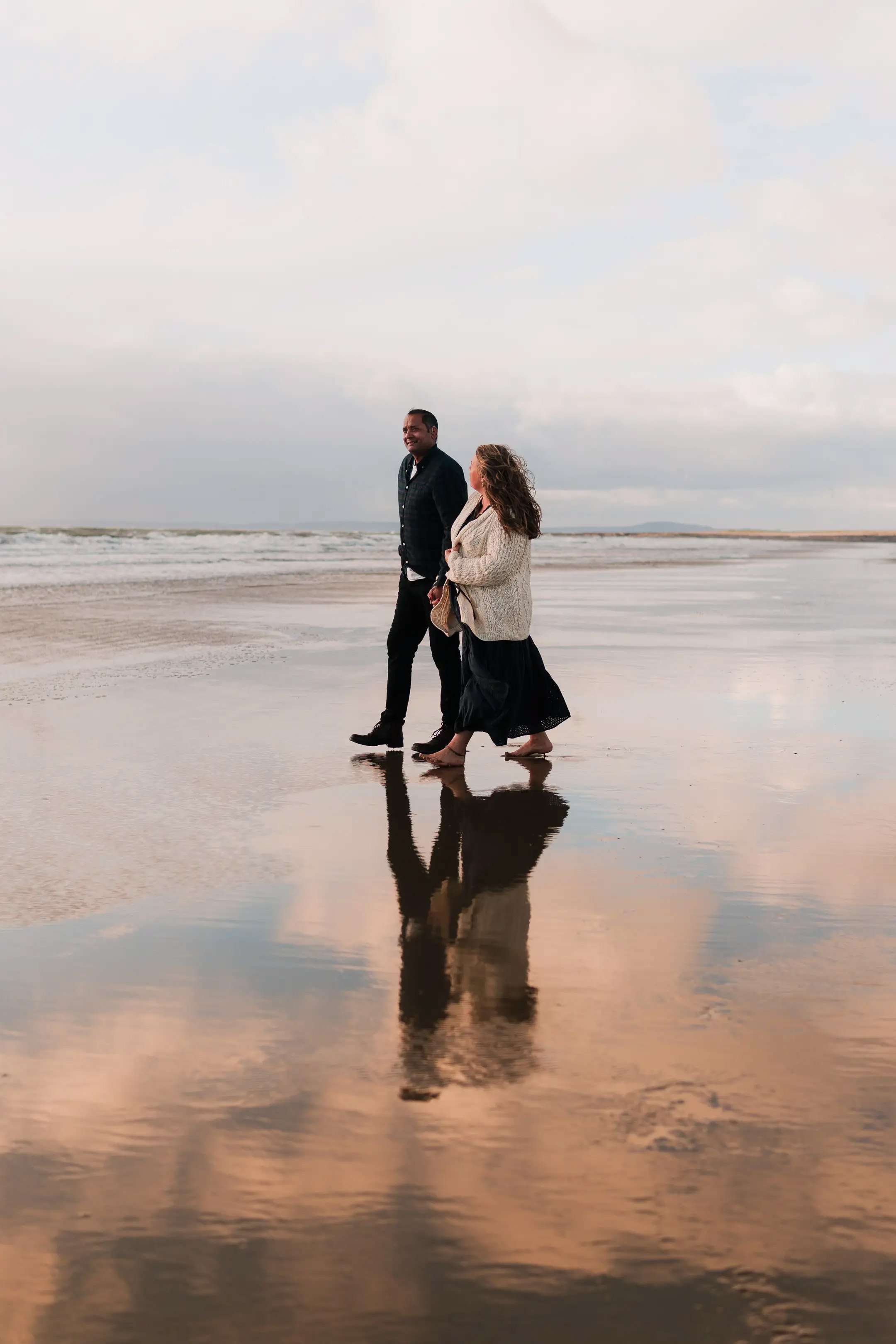 Rest Bay engagement photographer sunset by Luke Tattersall.