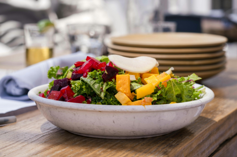 Fresh salad display for corporate catering event.