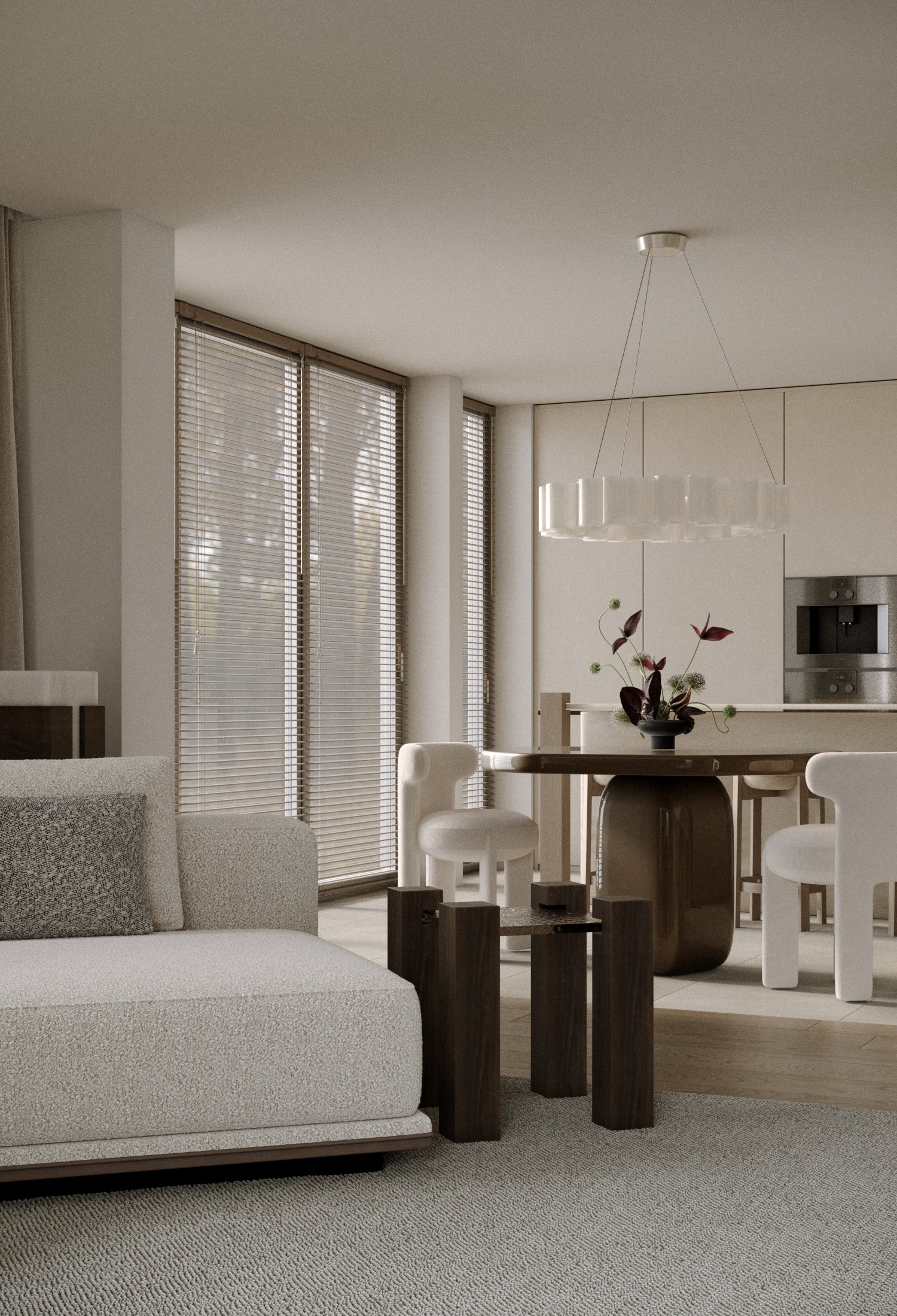 Modern living room with beige sofa, wooden coffee table, and dining area with white chairs and a vase with dark red and green plants.