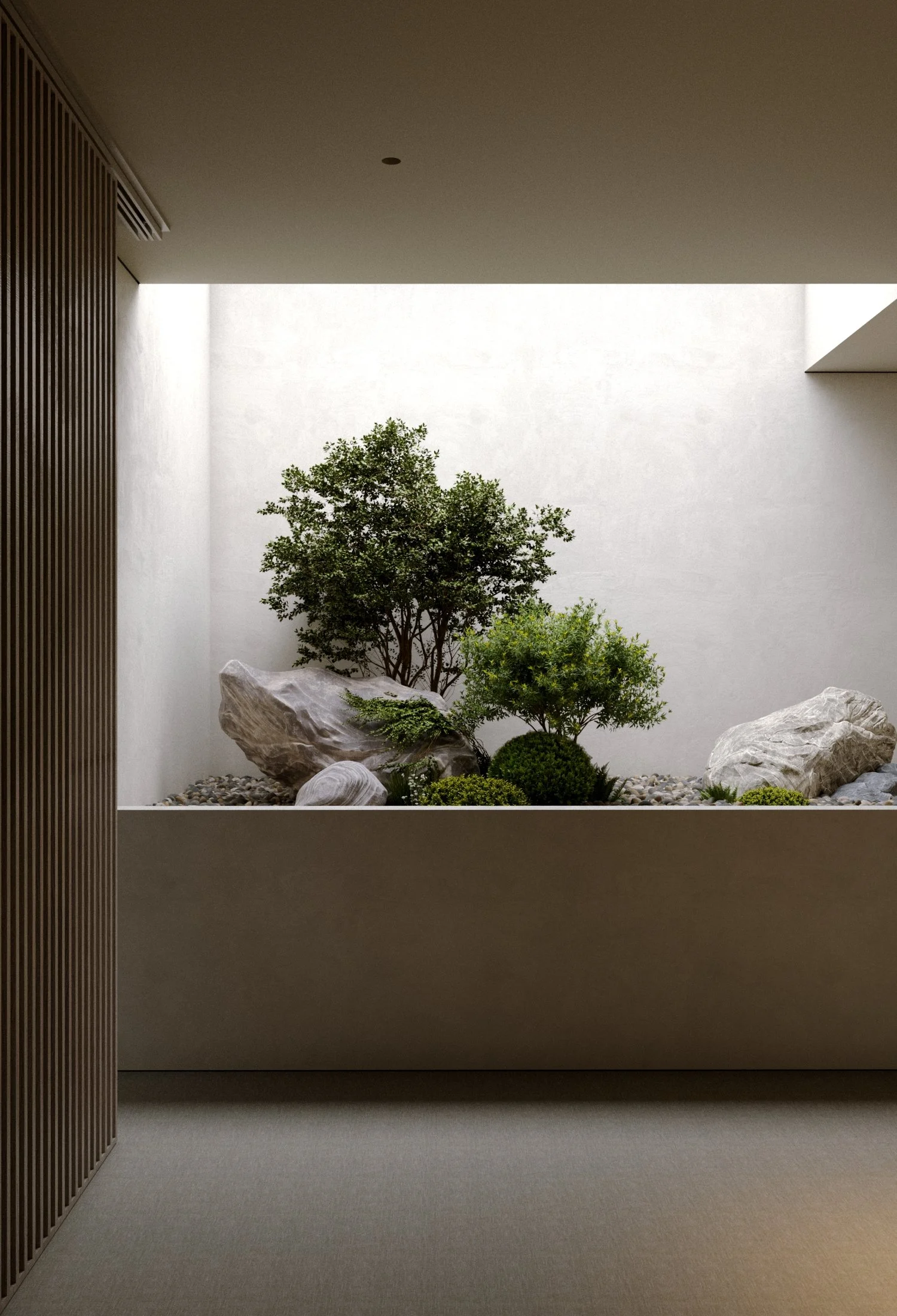 Minimalist indoor garden with small trees and rocks, enclosed by white walls and a skylight.