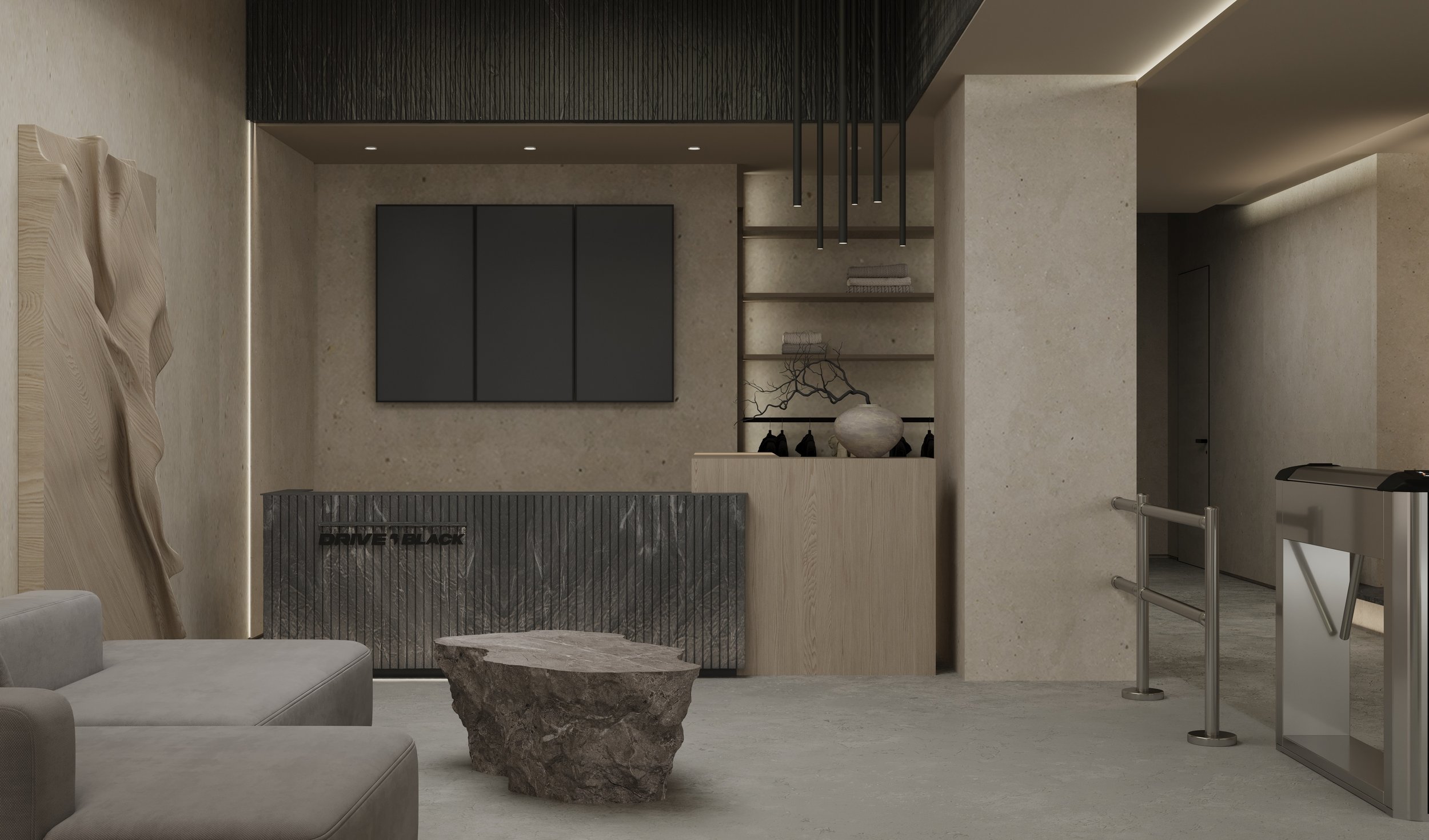 Modern interior lobby with stone and wood accents, featuring a stone coffee table, a sofa, wall-mounted TV, decorative shelf with a vase and branches, and a security turnstile.