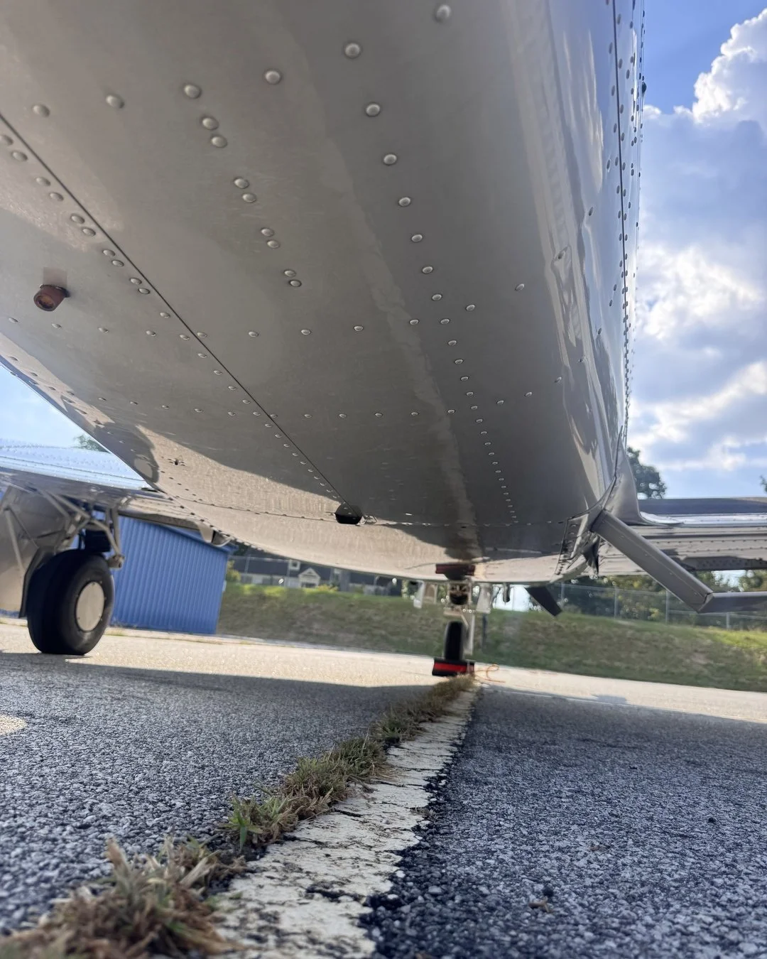Aircraft underbody after degreasing during exterior detailing at PDK Airport