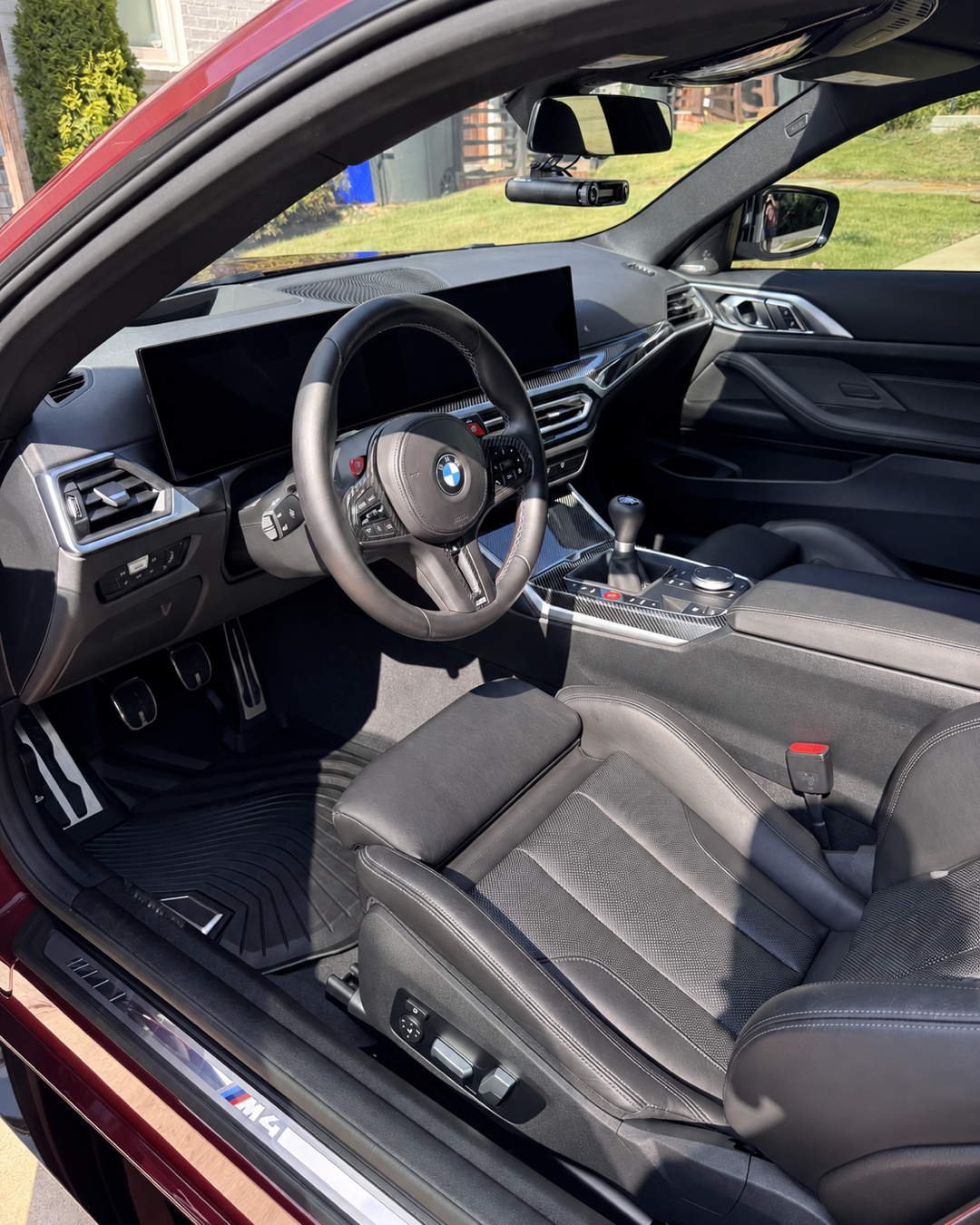 Finished BMW M4 Competition cabin after mobile detailing in Homewood, Alabama.