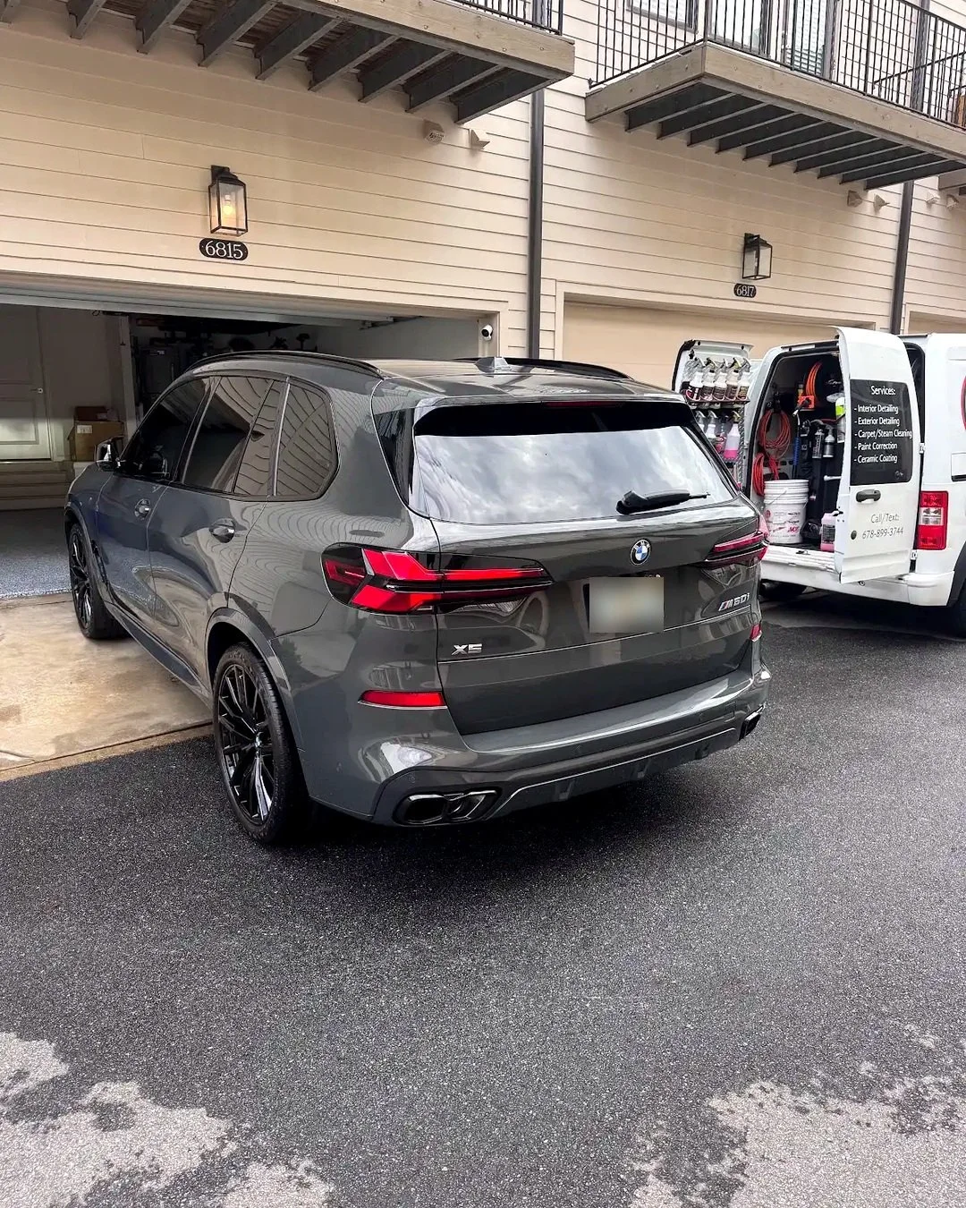 Rear exterior of a black BMW X5 after ceramic-coating maintenance in Sandy Springs, Georgia