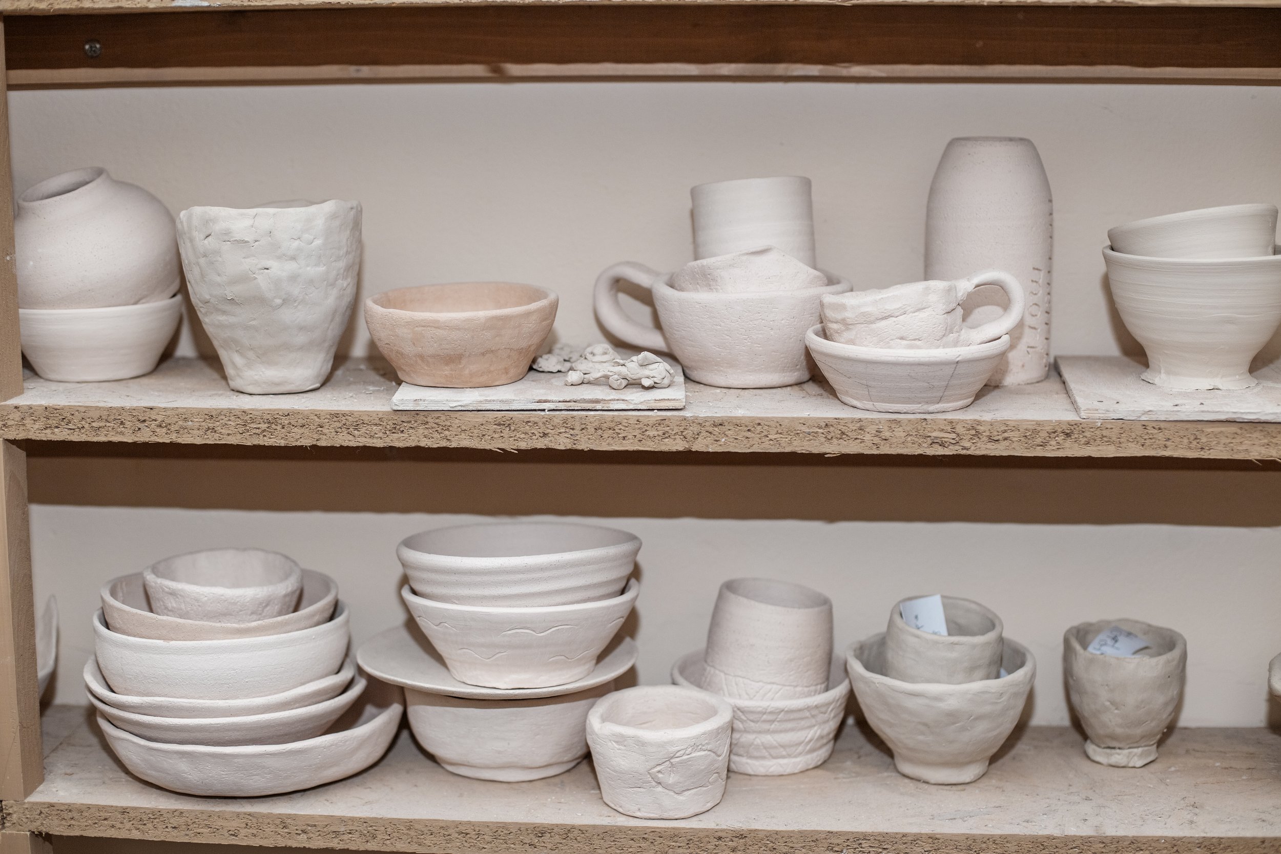 wooden-shelving-in-pottery-workshop-which-has-pot-2023-11-27-05-36-44-utc.jpg