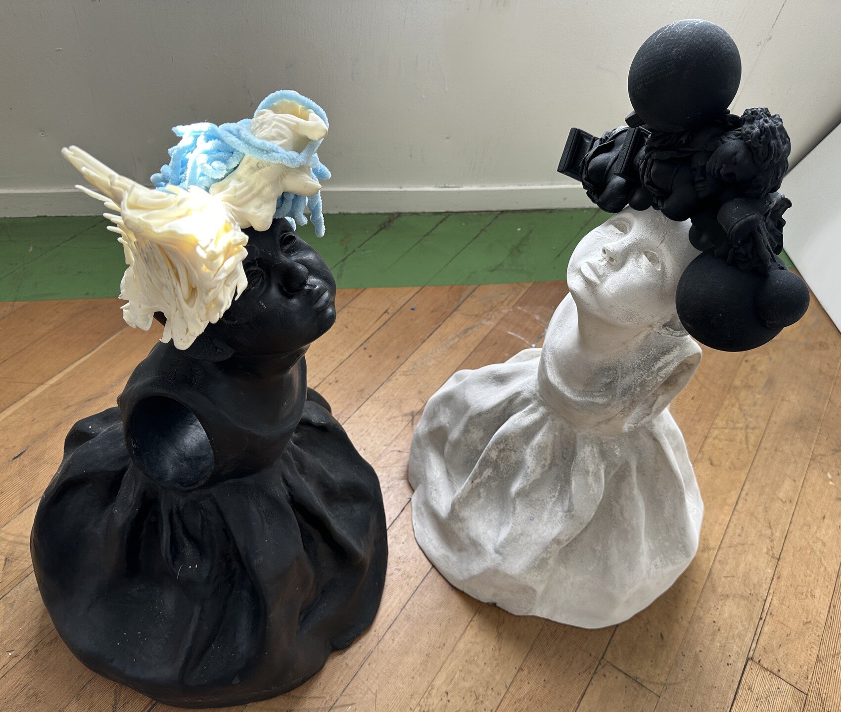sisters, cast cement and 3D printed, conceived over more than a decade. the figures were cast in multiple colors knowing something could come of them. Each carries part of the other. Humans are frail, as children and forever. We need each other to lo