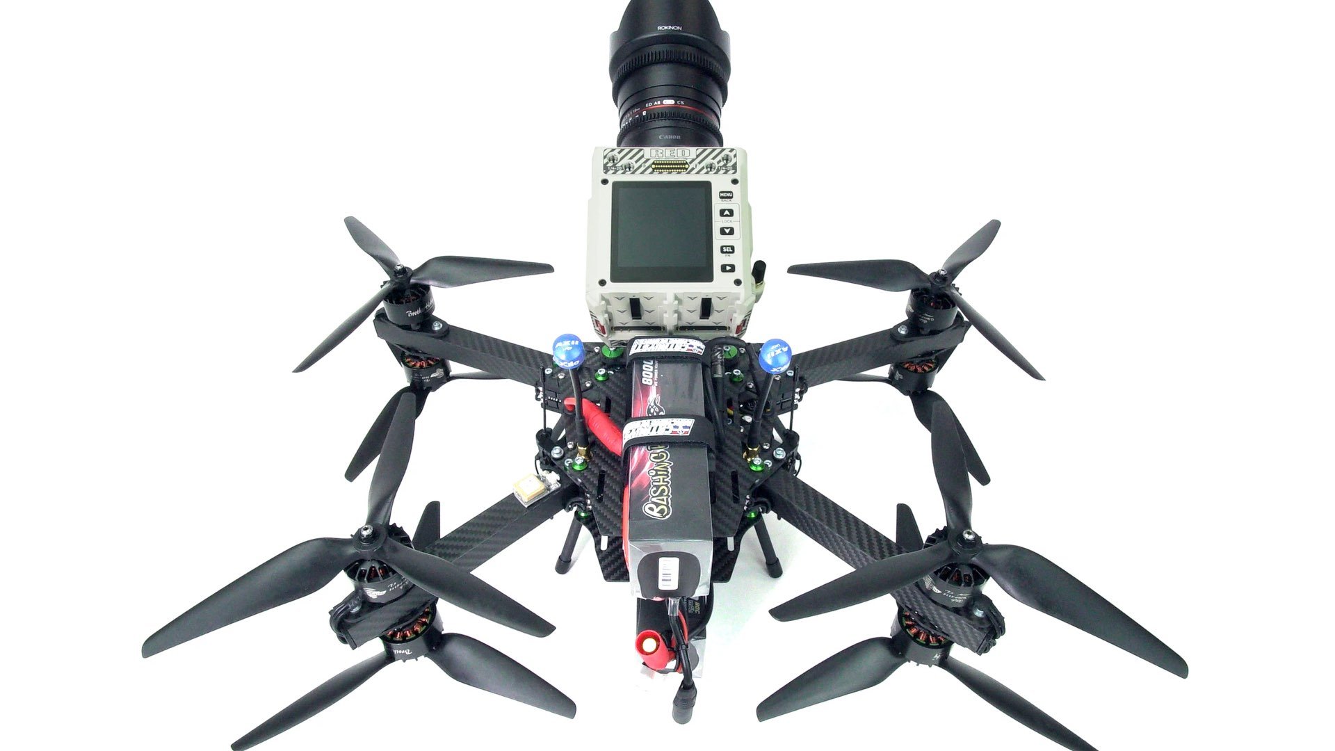 Image of Cine FPV drone equipped to lift Red Komodo and Black Magic Pocket 6k Camera, commonly utilized in car commercials and action movies.