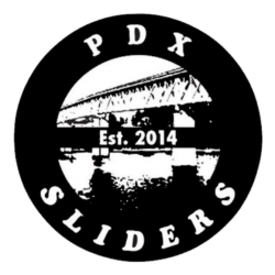 Circular logo with all caps text 'PDX SLIDERS' around the circle, featuring an image of a bridge and water in the background, and 'Est. 2014' in the center.