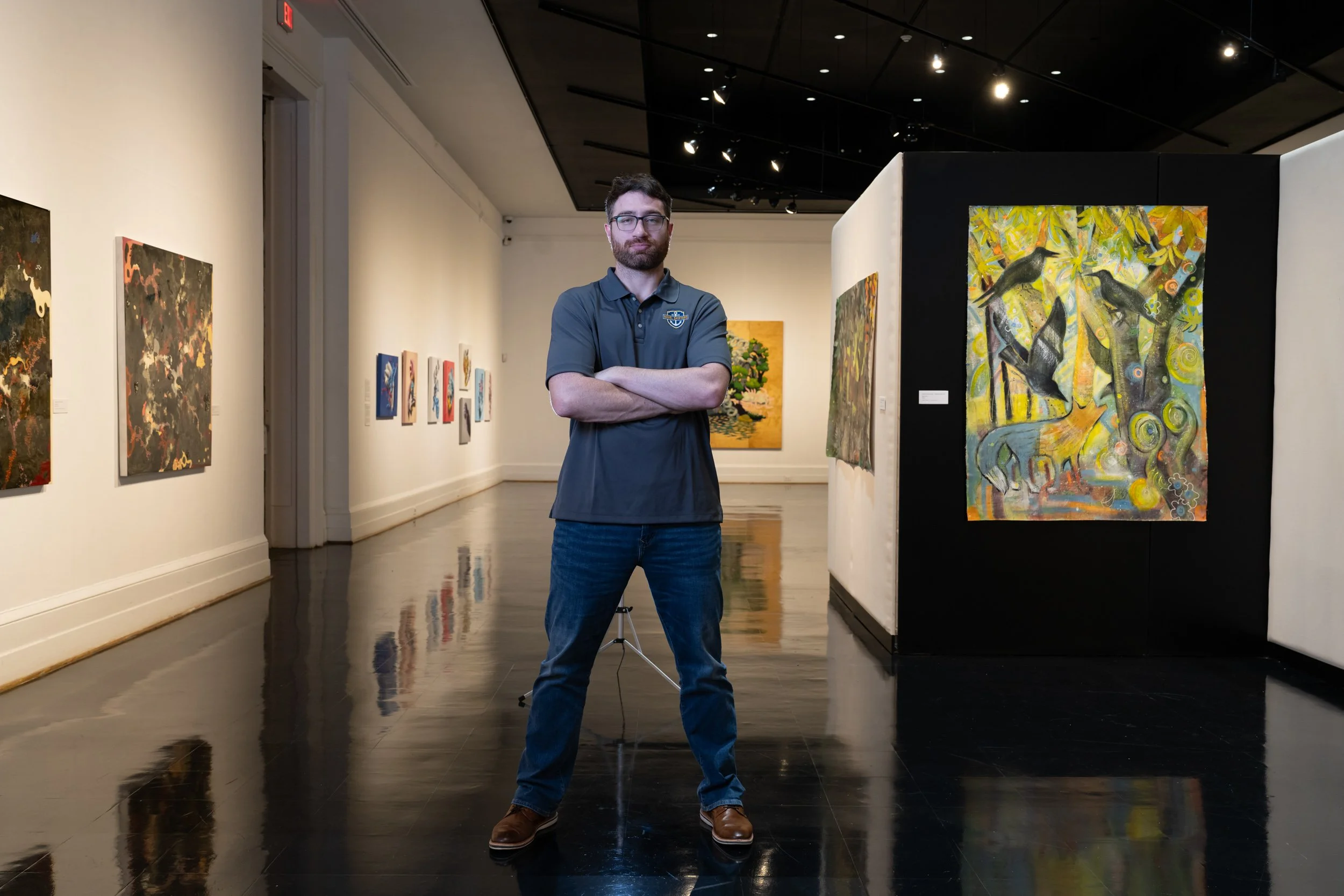 Commanding portrait of a curator in their art gallery
