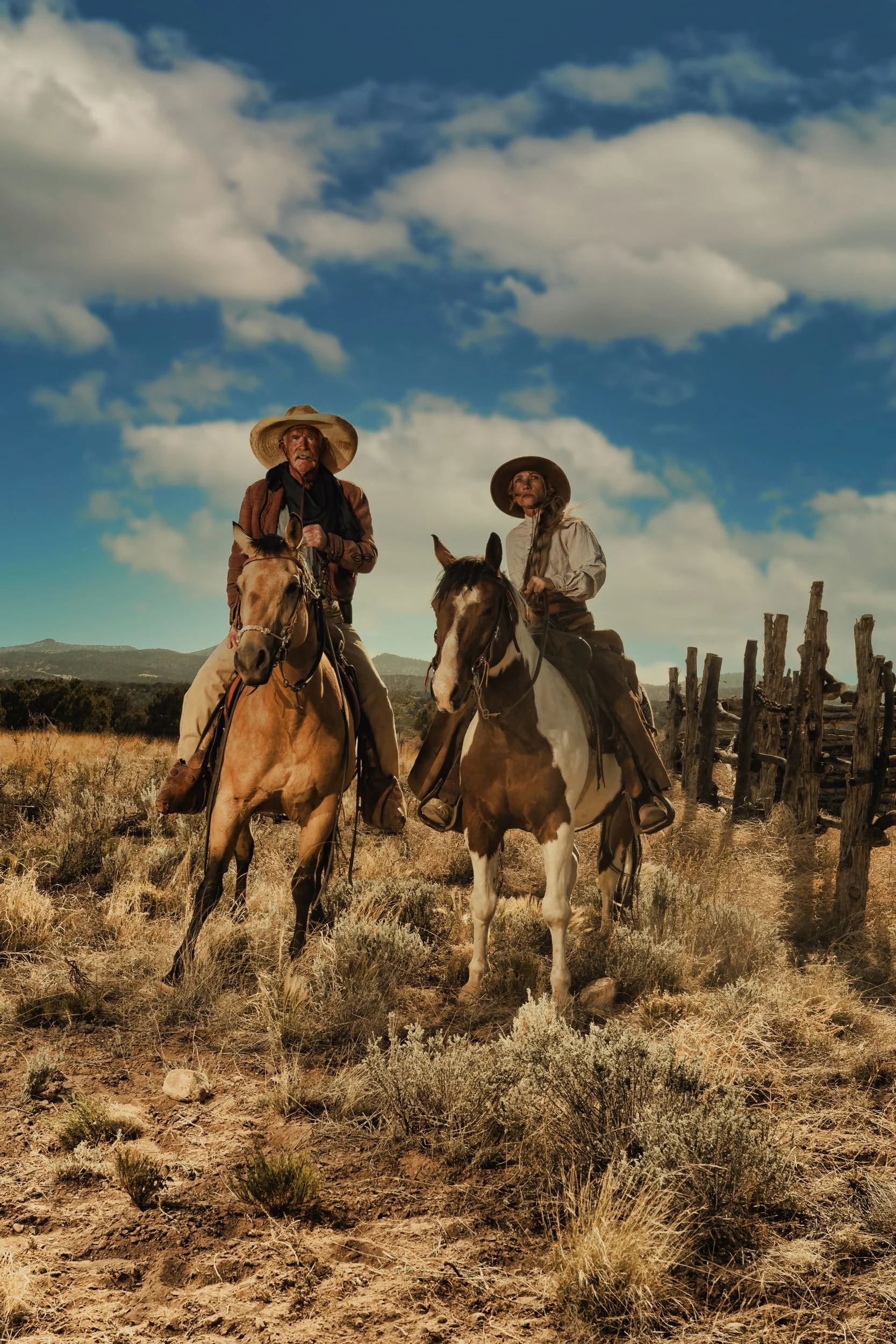 Painterly portrait of two cowboys, horseback riding