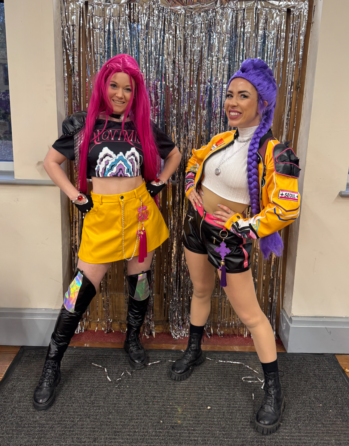 KPop Demon Hunters Rumi and Mira posing at a children's birthday party 