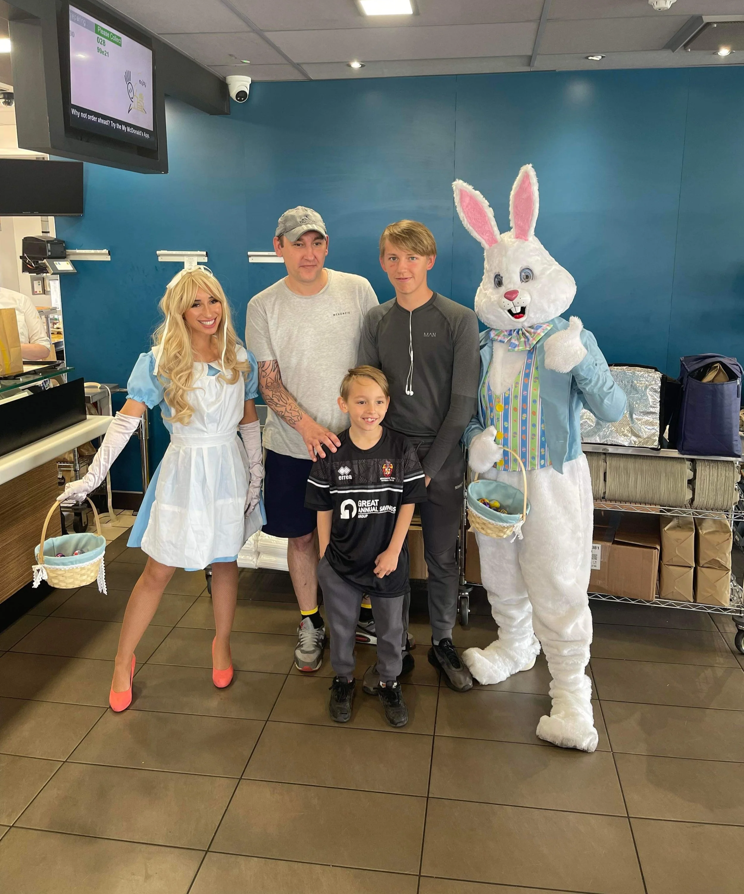 Alice in Wonderland and easter bunny mascot posing with guests at McDonalds in Darlington 