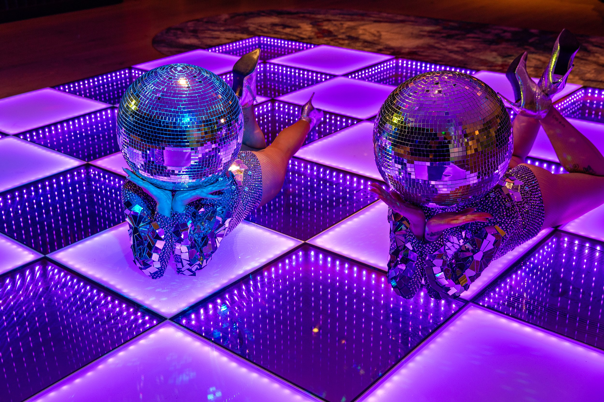 silver disco head dancers lying on LED dance floor at Hyatt Regency Hotel Stratford 