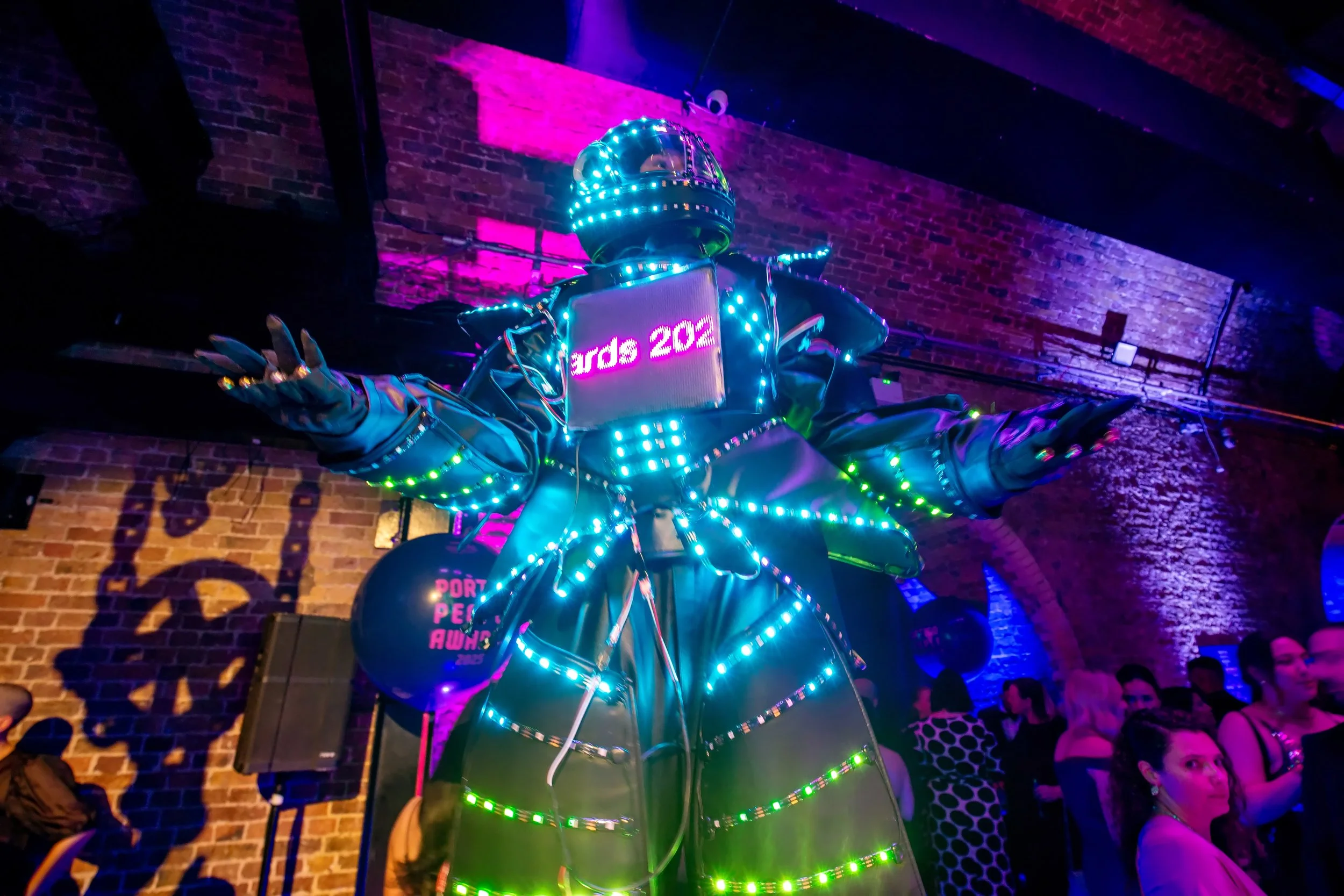 LED stilt walking Glowbot at Portico People awards at the steel yard London christmas corporate party 