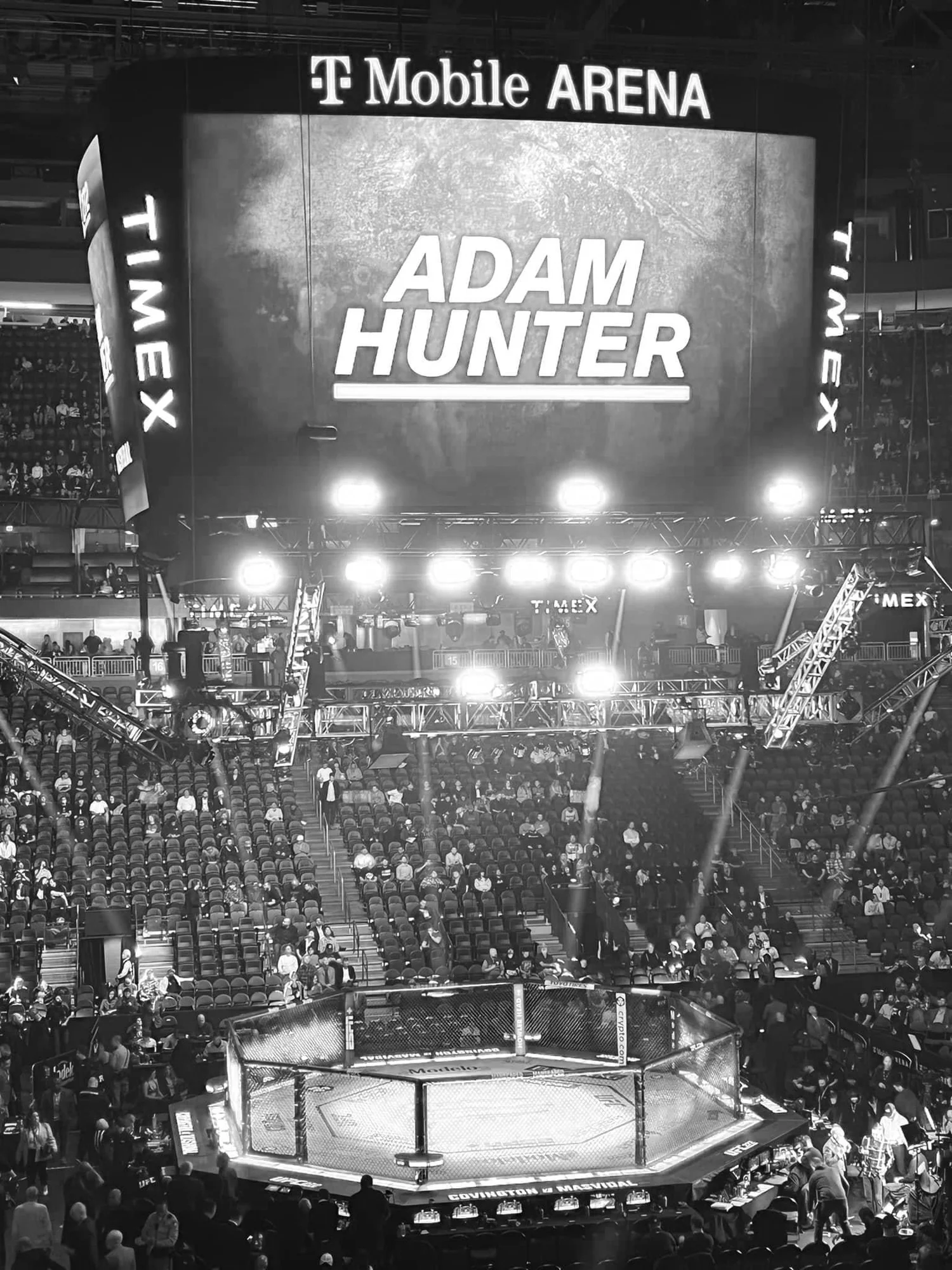 Adam Hunter headlining at T-Mobile Arena in Las Vegas, his name on the screen above the UFC octagon