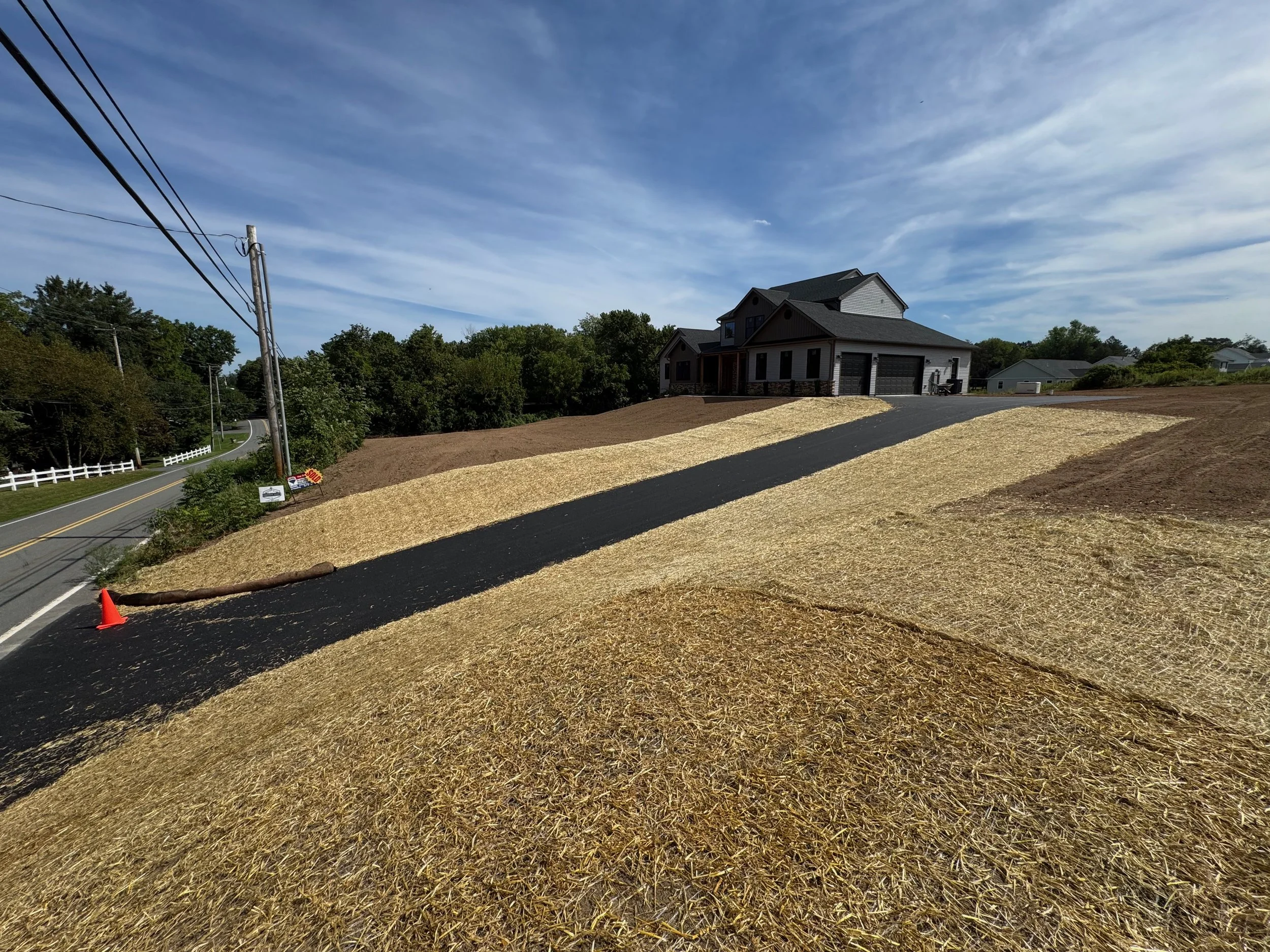 Final grade and topsoil for new home construction.