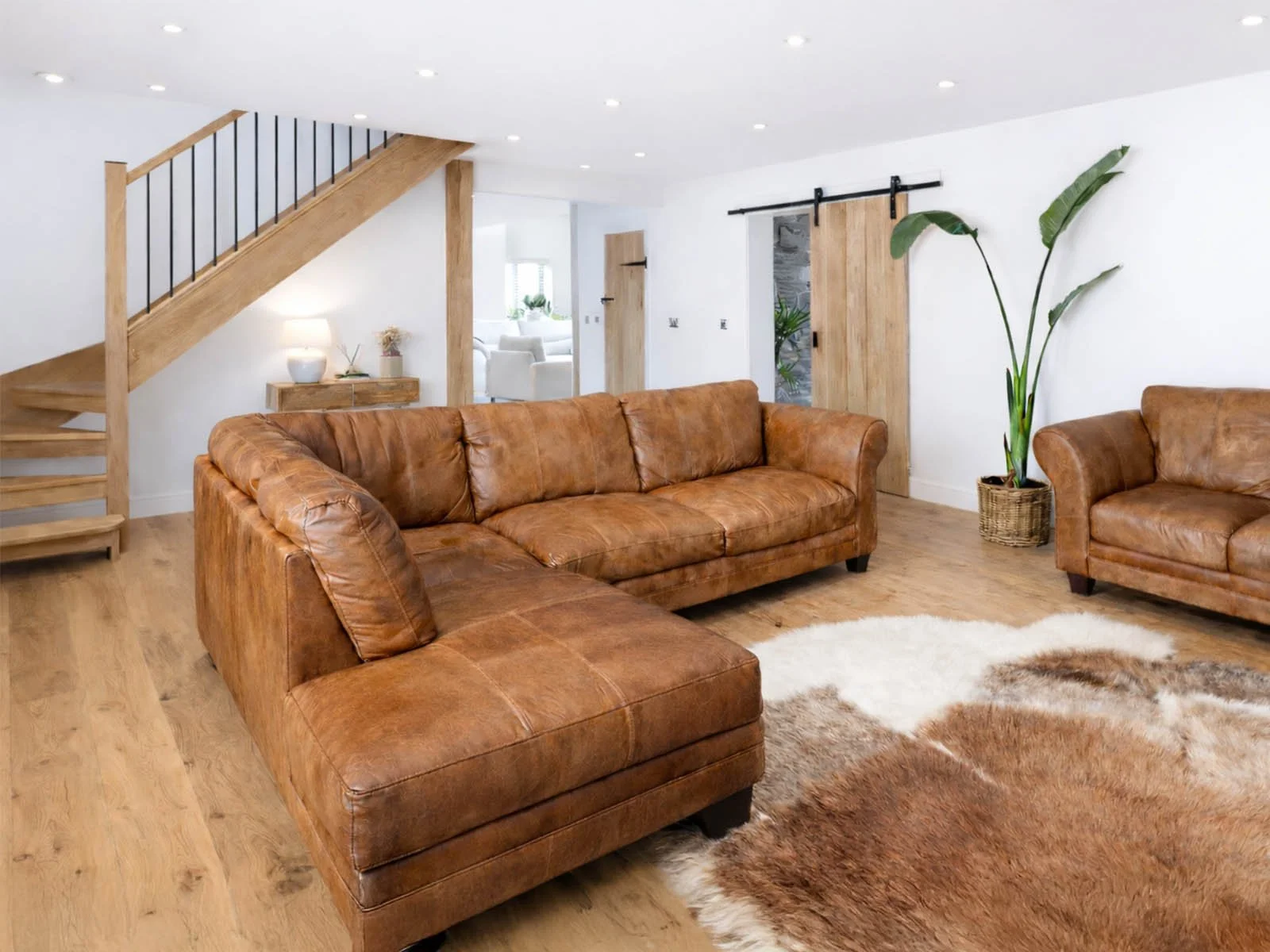 warm-living-room-leather-sofas-barn-conversion.jpg