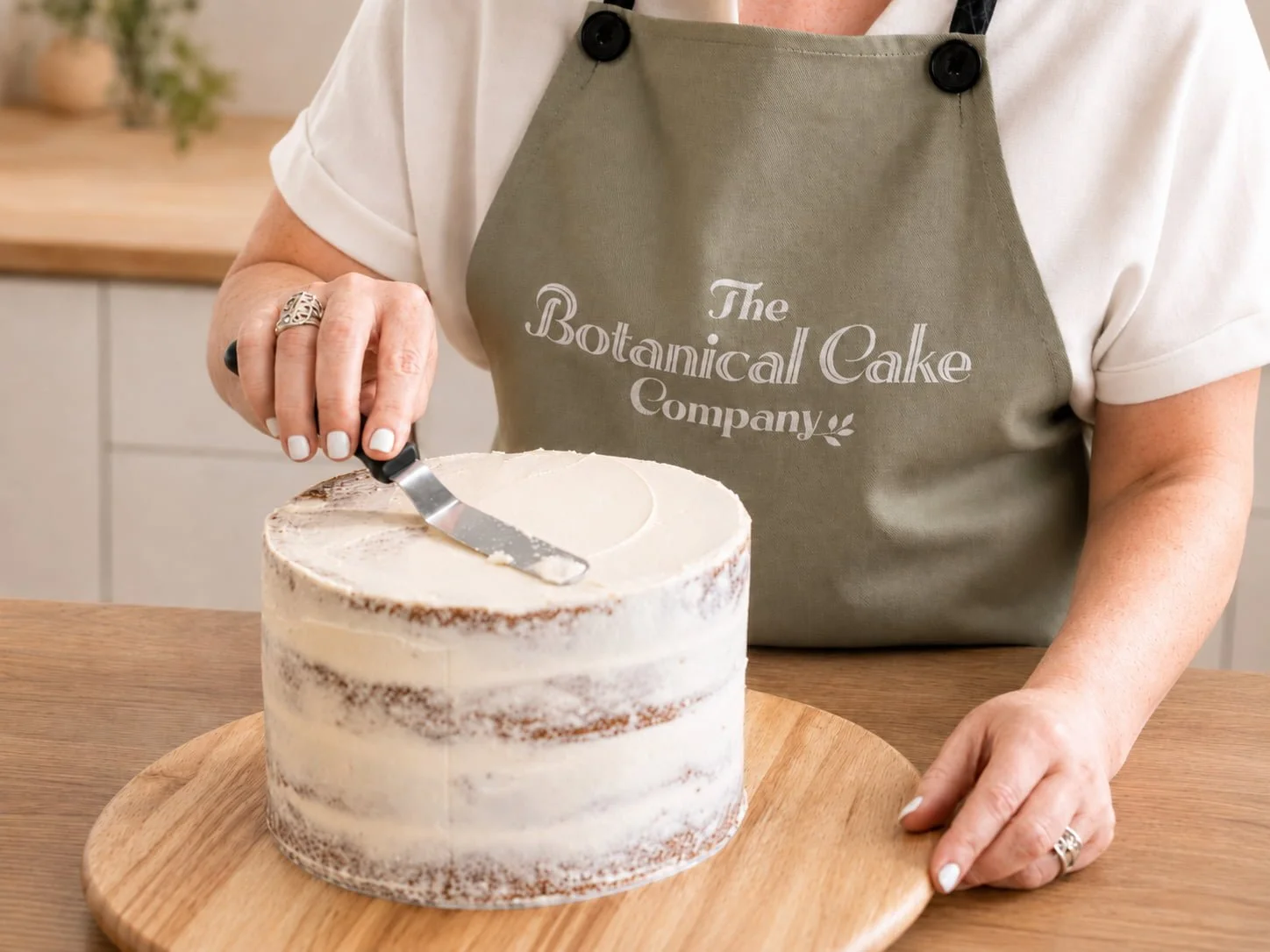 botanical-cake-company-brand-apron-cake-decorating.jpg