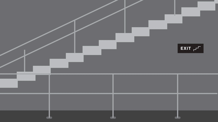 Kevin and his co-workers walk down the stairs calmly. 