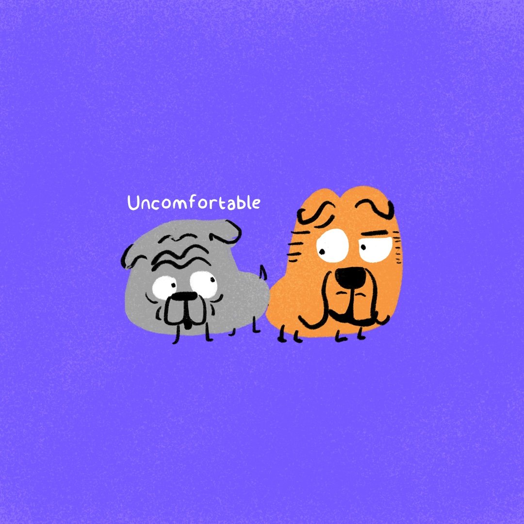 Cartoon drawing of two dogs, one gray and one orange, with humorous expressions. The gray dog looks uncomfortable with a worried face, and the orange dog looks mischievous. The word "Uncomfortable" is written above the gray dog.