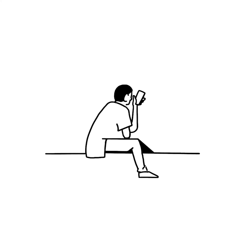 A black and white line drawing of a person sitting on the ground, looking at their phone.