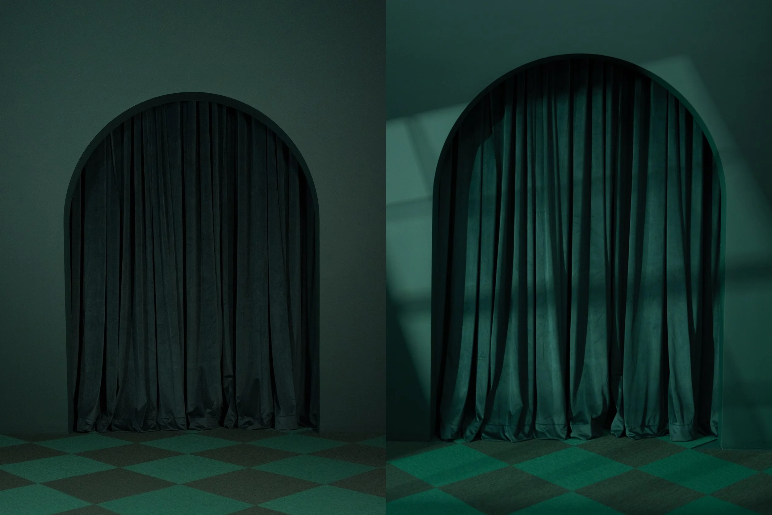 Dimly lit theater with closed dark curtains and checkered floor, illuminated with greenish light