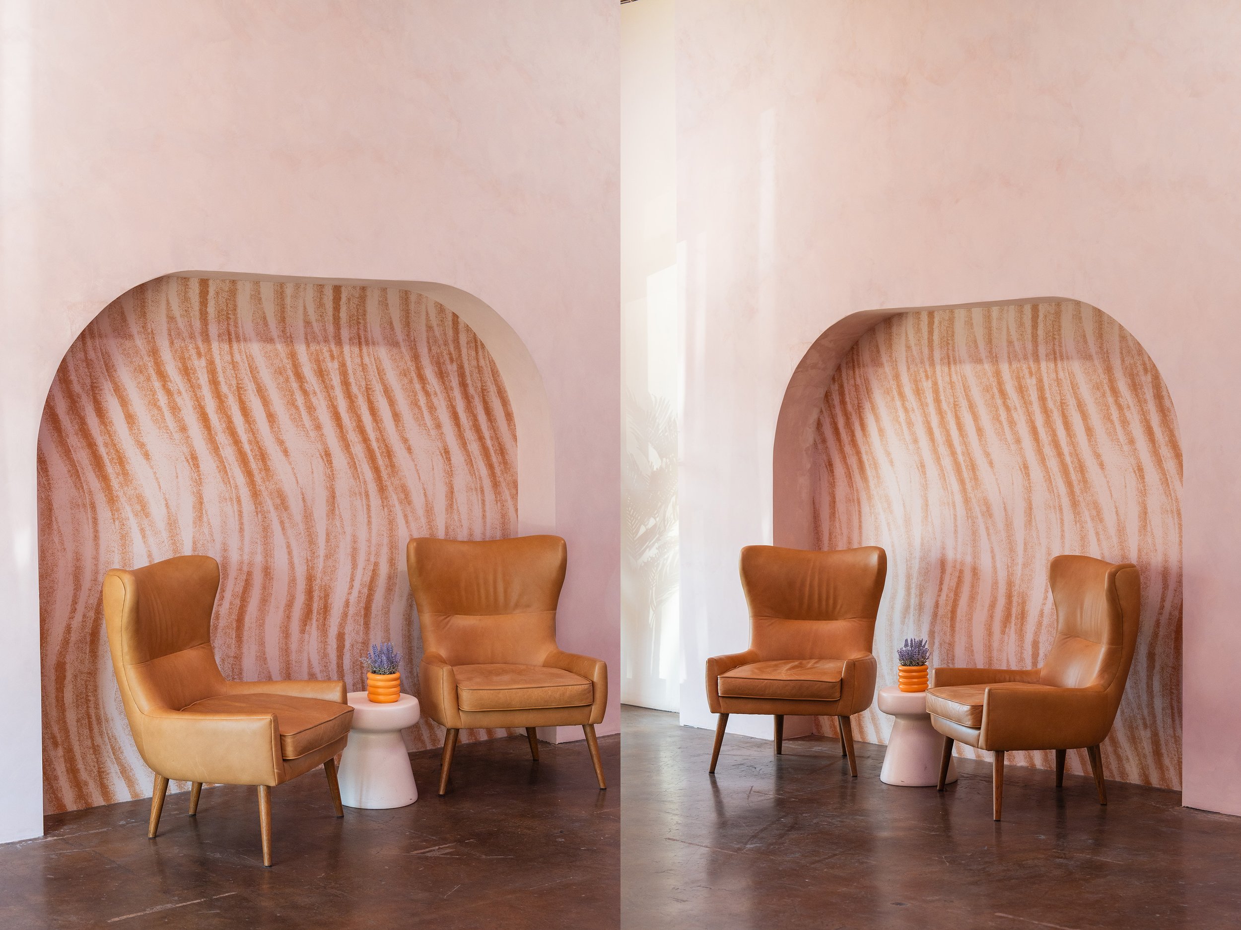 Two interior spaces featuring beige leather armchairs and small white side tables in front of arch-shaped alcoves with wavy patterns on the wall.